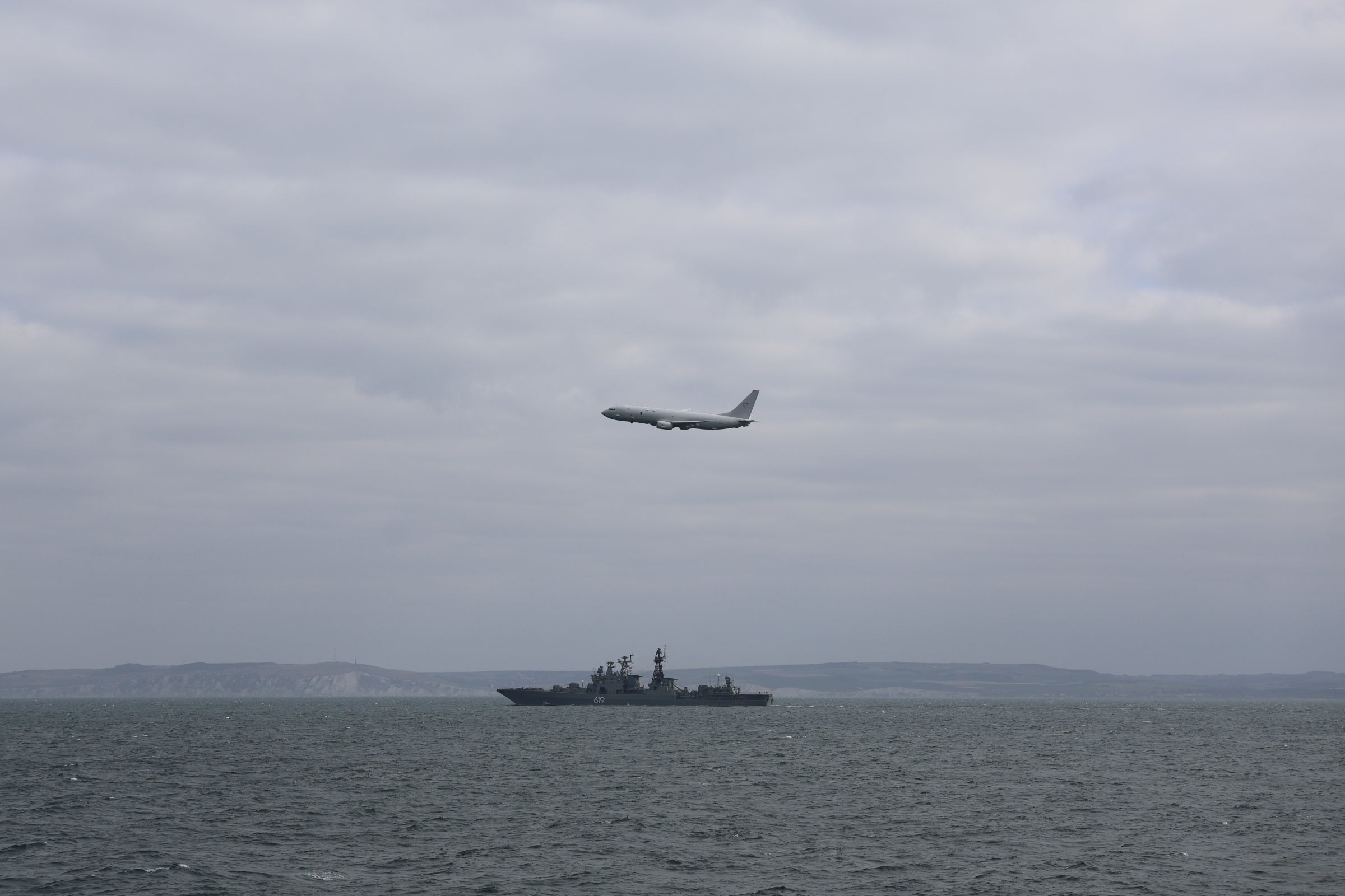 An RAF P8 Poseidon aircraft from RAF Lossiemouth shadows a Russian destroyer ship as it sails through the English Channel in March