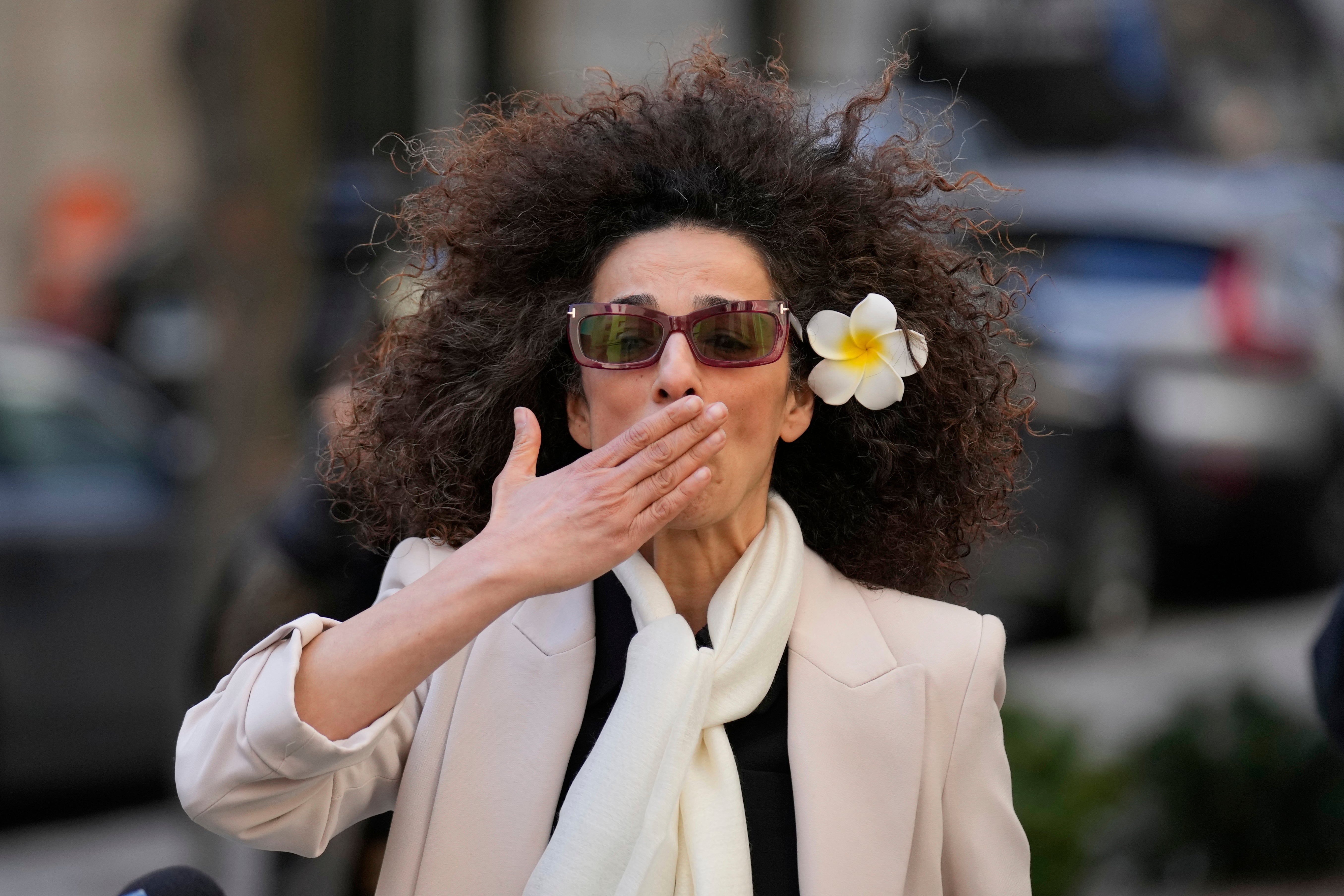 Masih Alinejad blows a kiss to supporters outside the federal courthouse