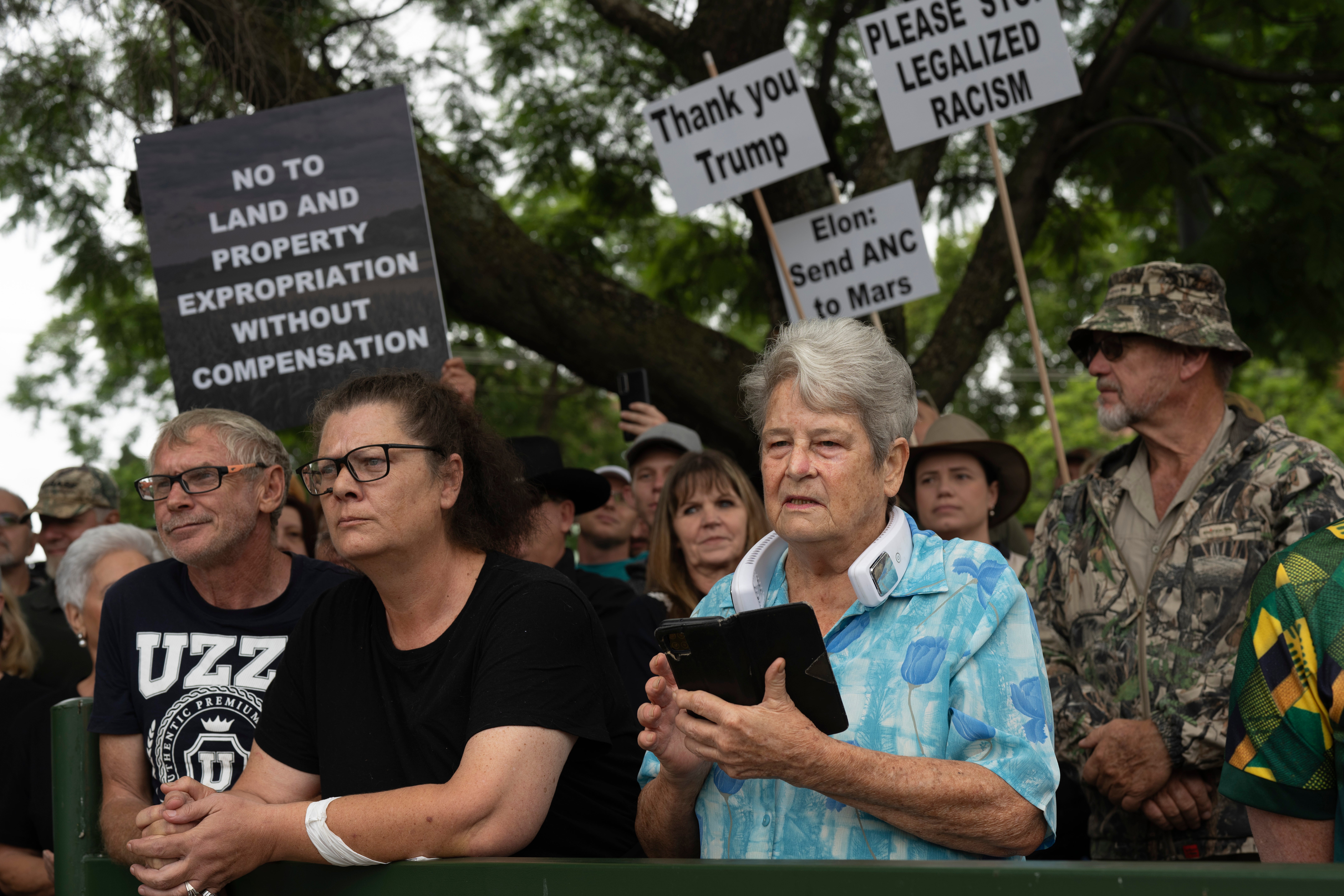 White South Africans demonstrate in support of U.S. President Donald Trump in front of the U.S. embassy in Pretoria, South Africa, Feb. 15, 2025. (AP Photo/Jerome Delay, File)