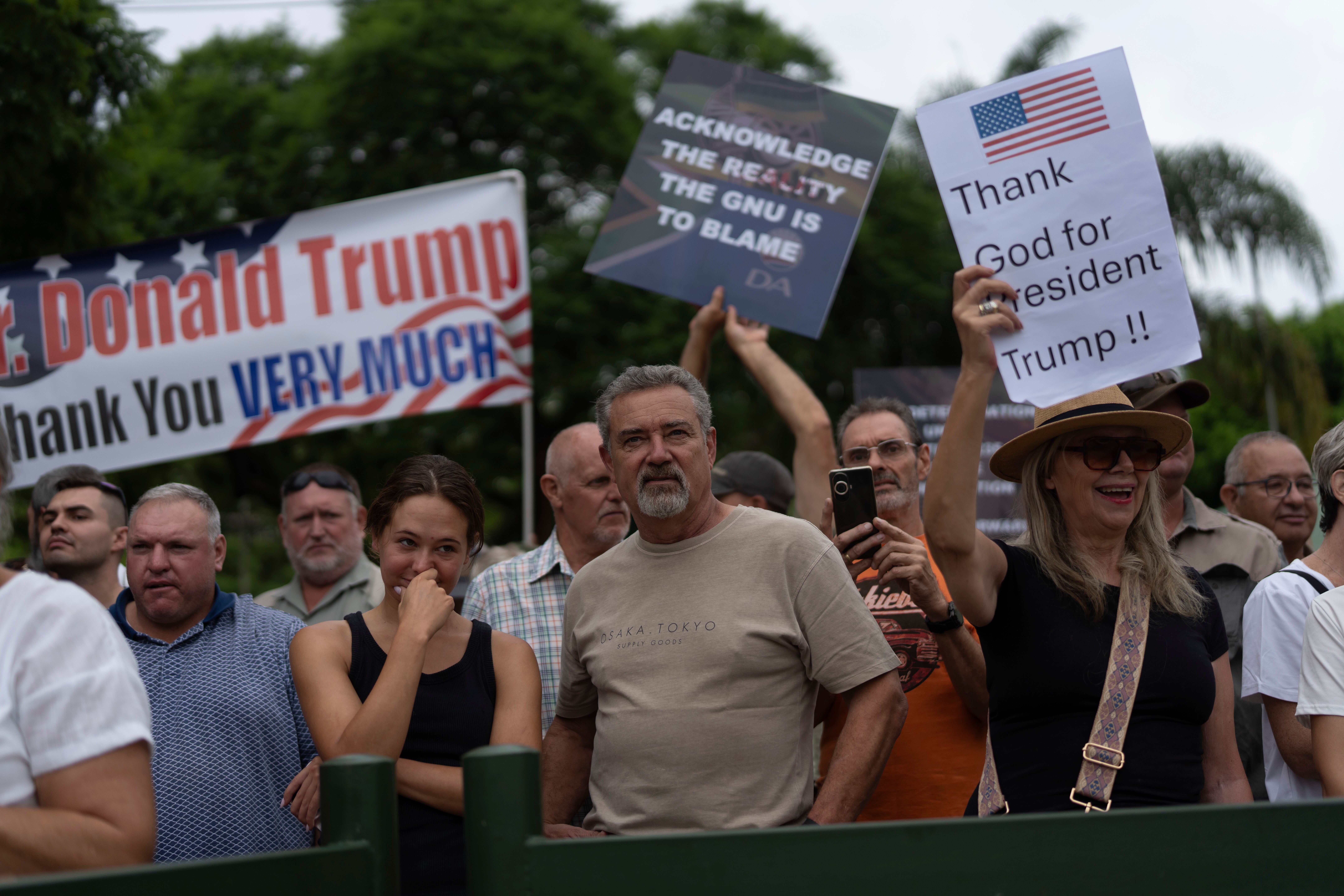 White South Africans demonstrate in support of U.S. President Donald Trump in front of the U.S. embassy in Pretoria, South Africa, Feb. 15, 2025. (AP Photo/Jerome Delay, File)