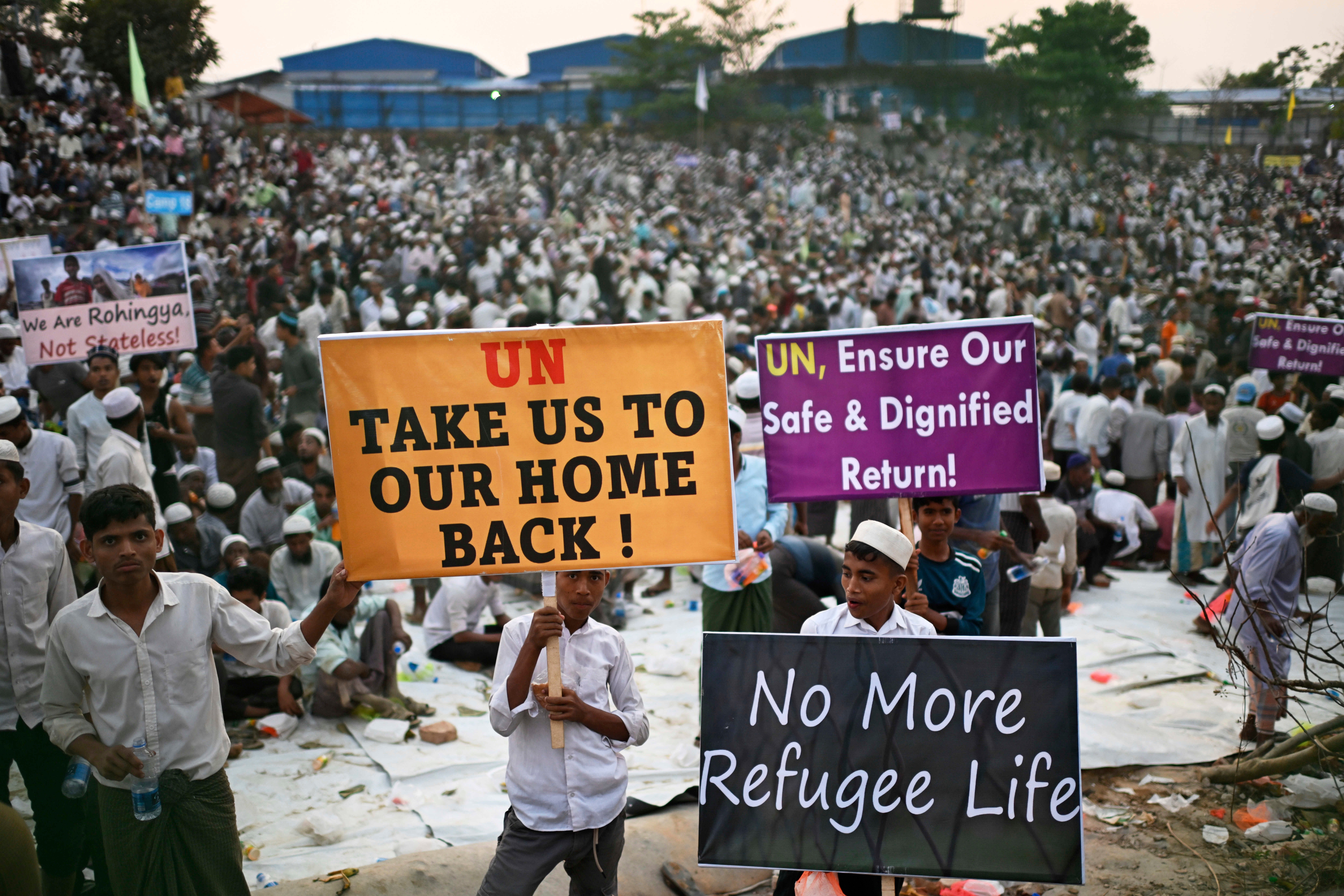 <p>Rohingya refugee children carry banners during a visit by UN secretary general António Guterres at the Ukhiya camp in Cox's Bazar, Bangladesh, on 14 March 2025</p>