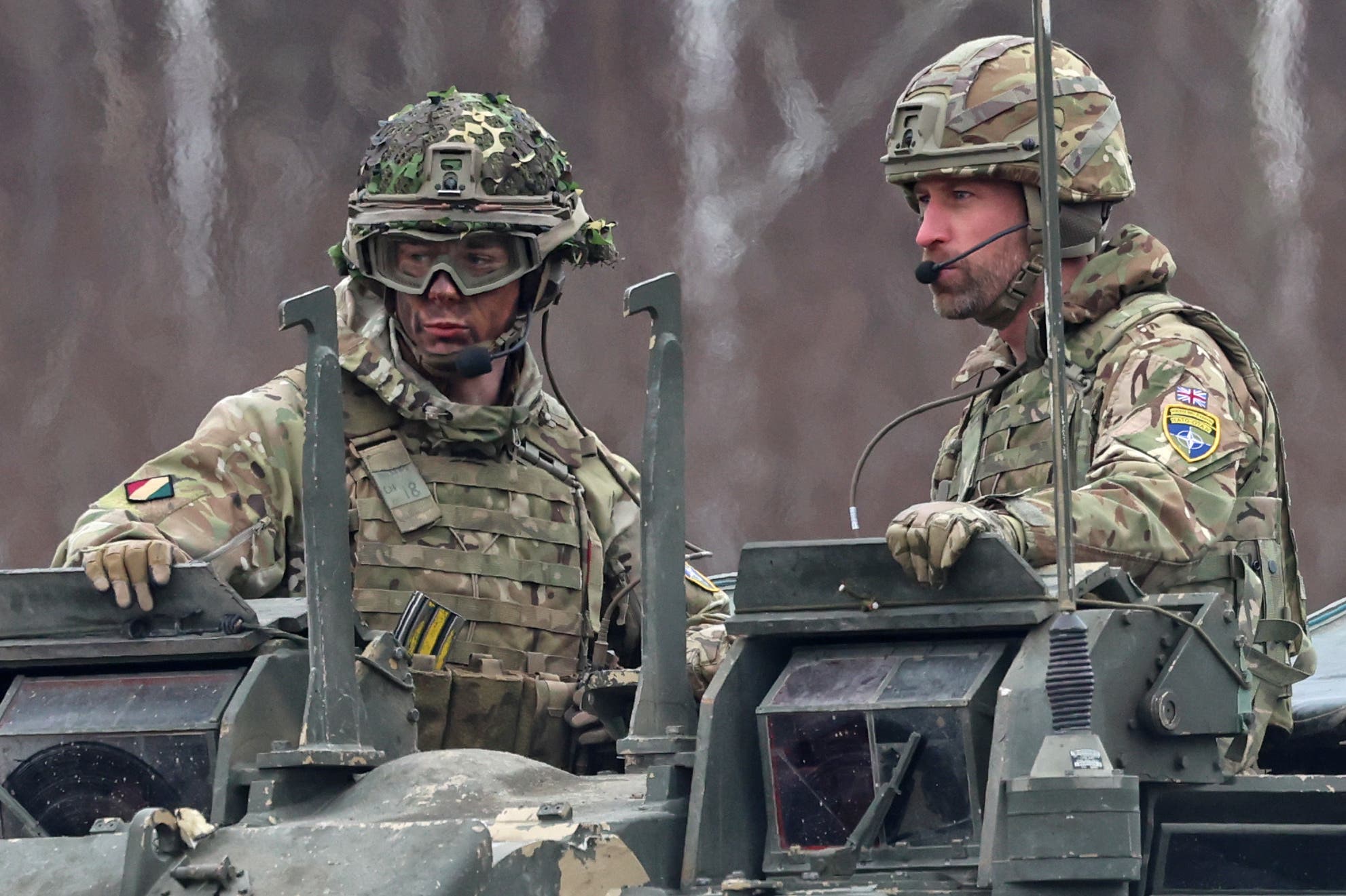 The Prince of Wales (right) arrives in a Challenger 2 battle tank to attend a field training field at Tapa Camp (Chris Jackson/PA)