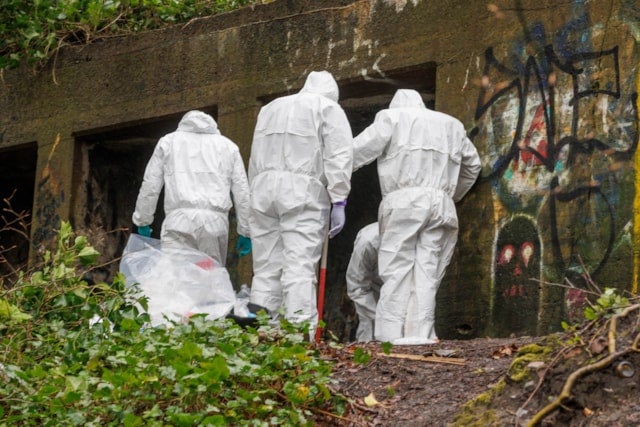 Forensic officers search a concrete bunker in Kersal Dale nature reserve, Salford, after the discovery of the torso of Stuart Everett on 4 April last year