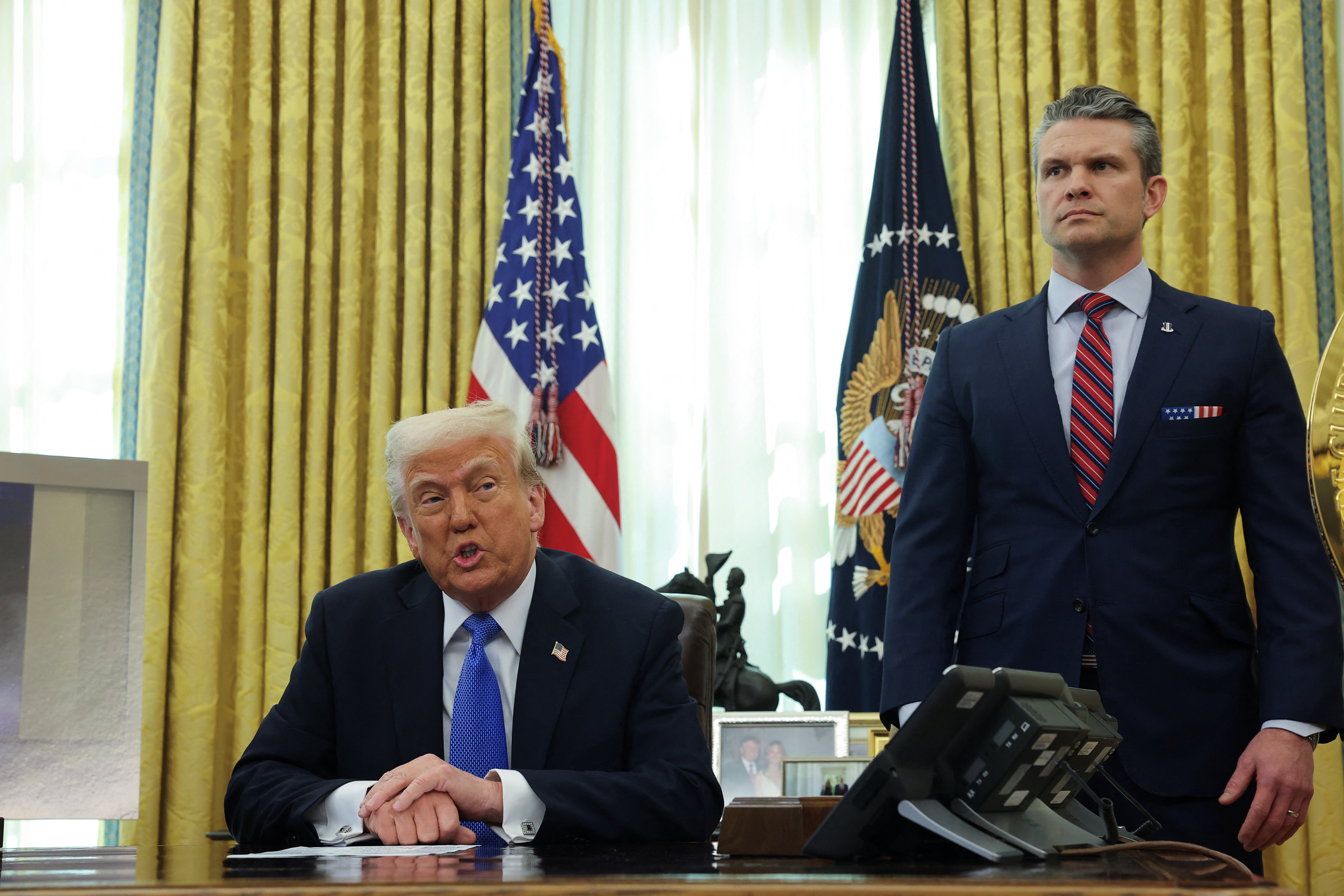 U.S. President Donald Trump delivers remarks with Defense Secretary Pete Hegseth in the Oval Office
