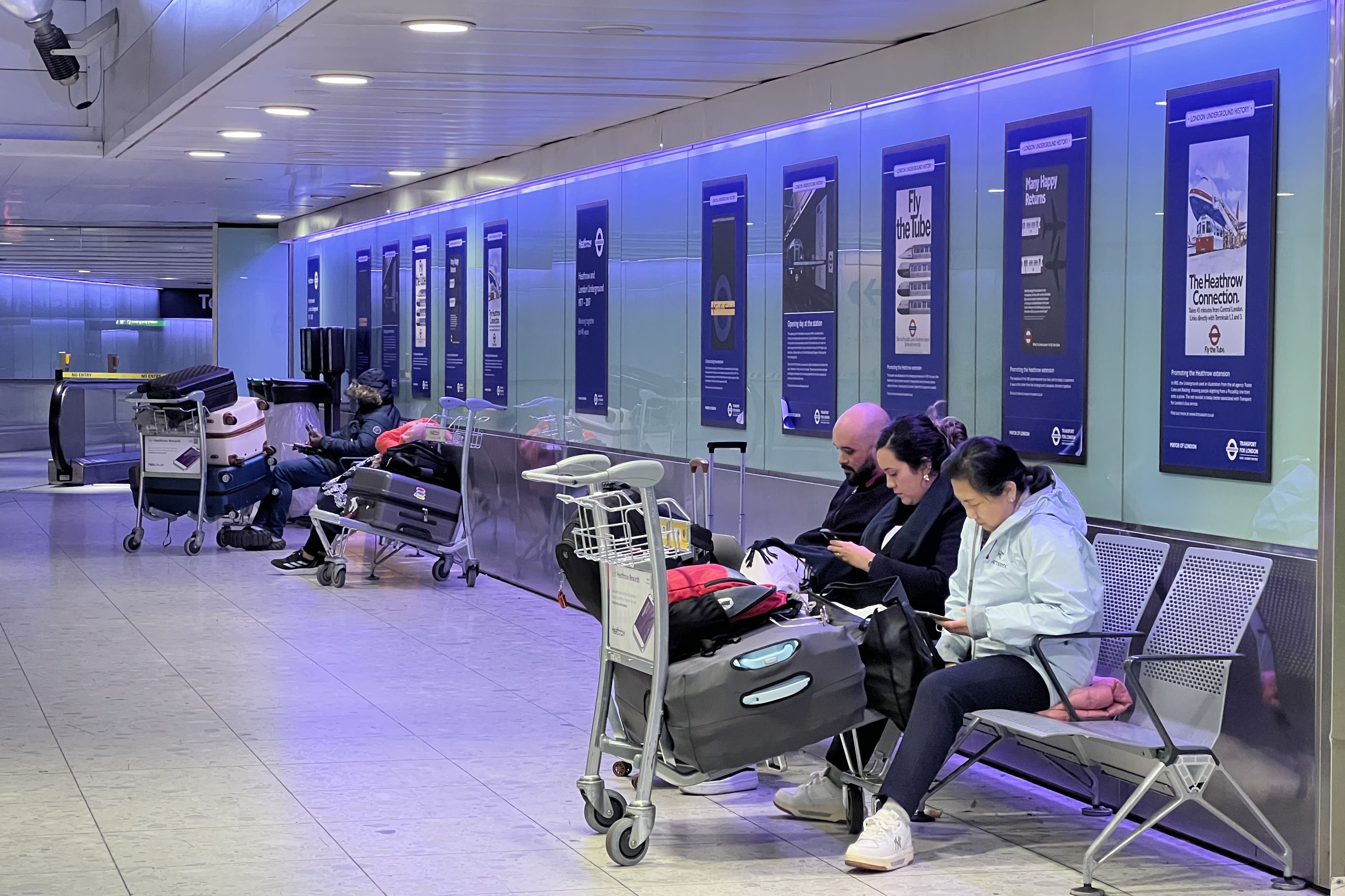 Stranded passengers at Heathrow Terminal 3 in London (Maja Smiejkowska/PA)