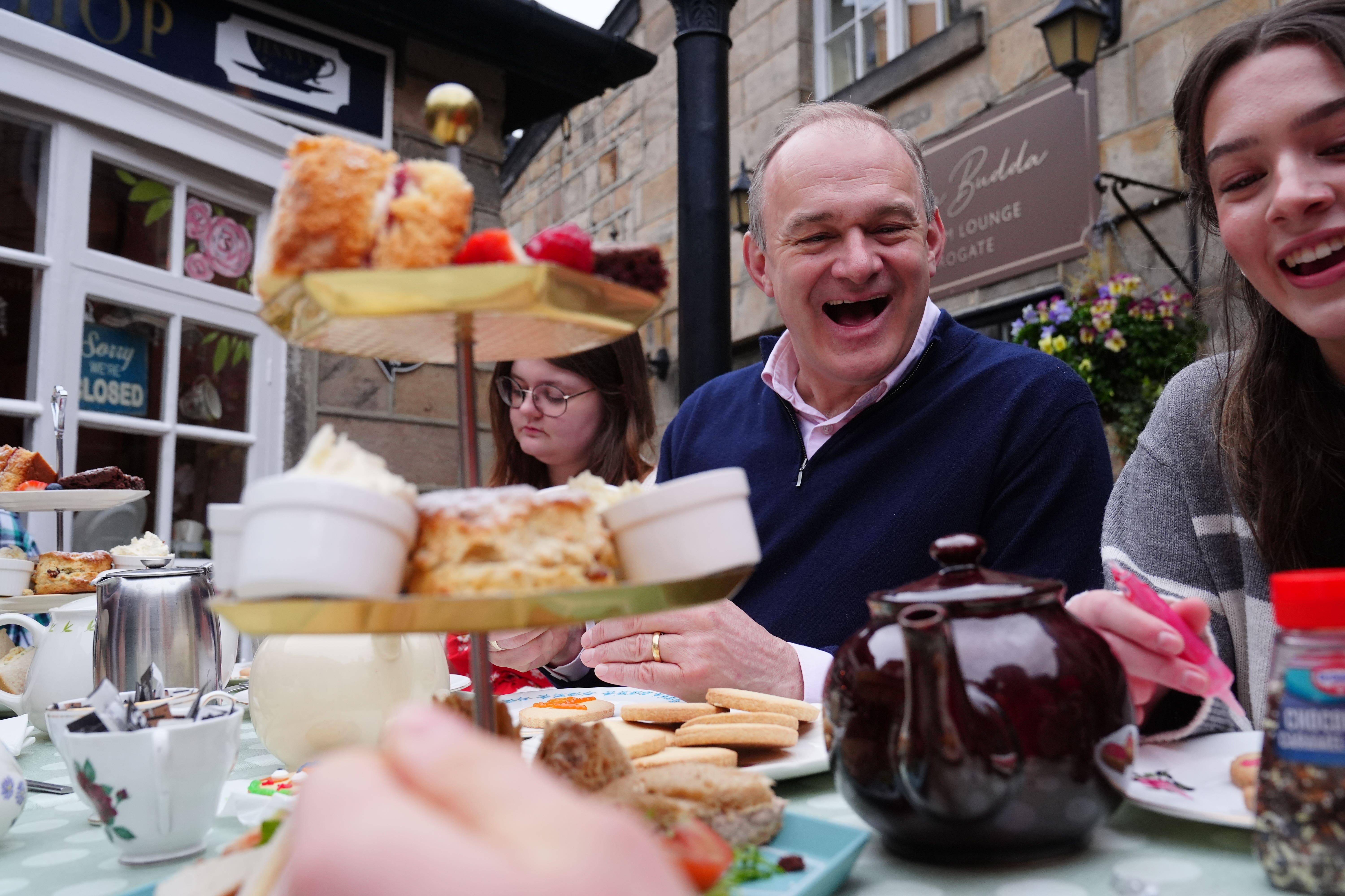 Liberal Democrat Leader Sir Ed Davey joins a group of young carers for a tea party at Jenny’s Tea Shop in Harrogate, North Yorkshire, ahead of his speech at the Liberal Democrats spring conference on Sunday (Owen Humphreys/PA)
