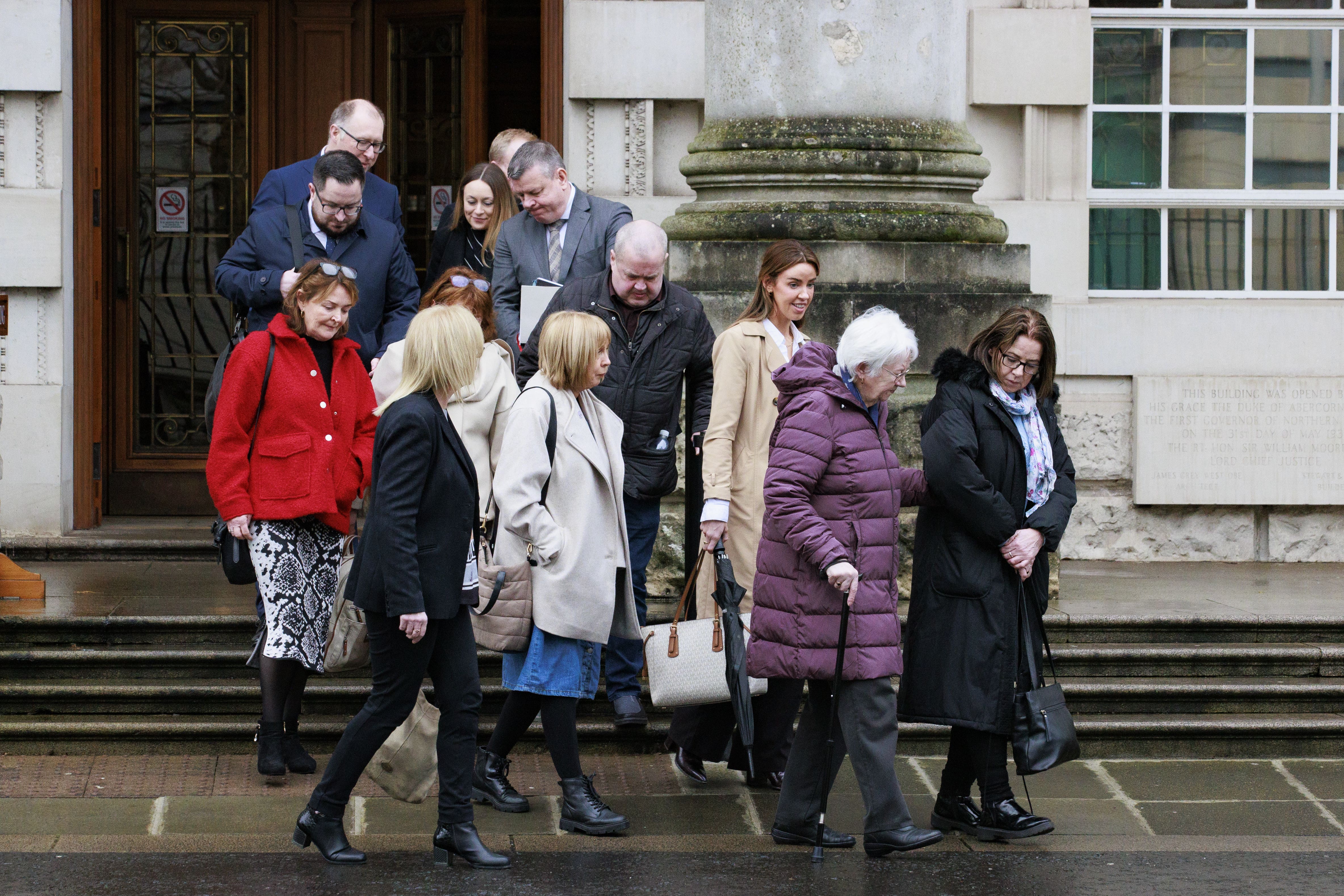 Family members of the Clonoe Four with legal representatives after a coroner ruled SAS soldiers were not justified in killing four IRA members in a 1992 ambush (Liam McBurney/PA)