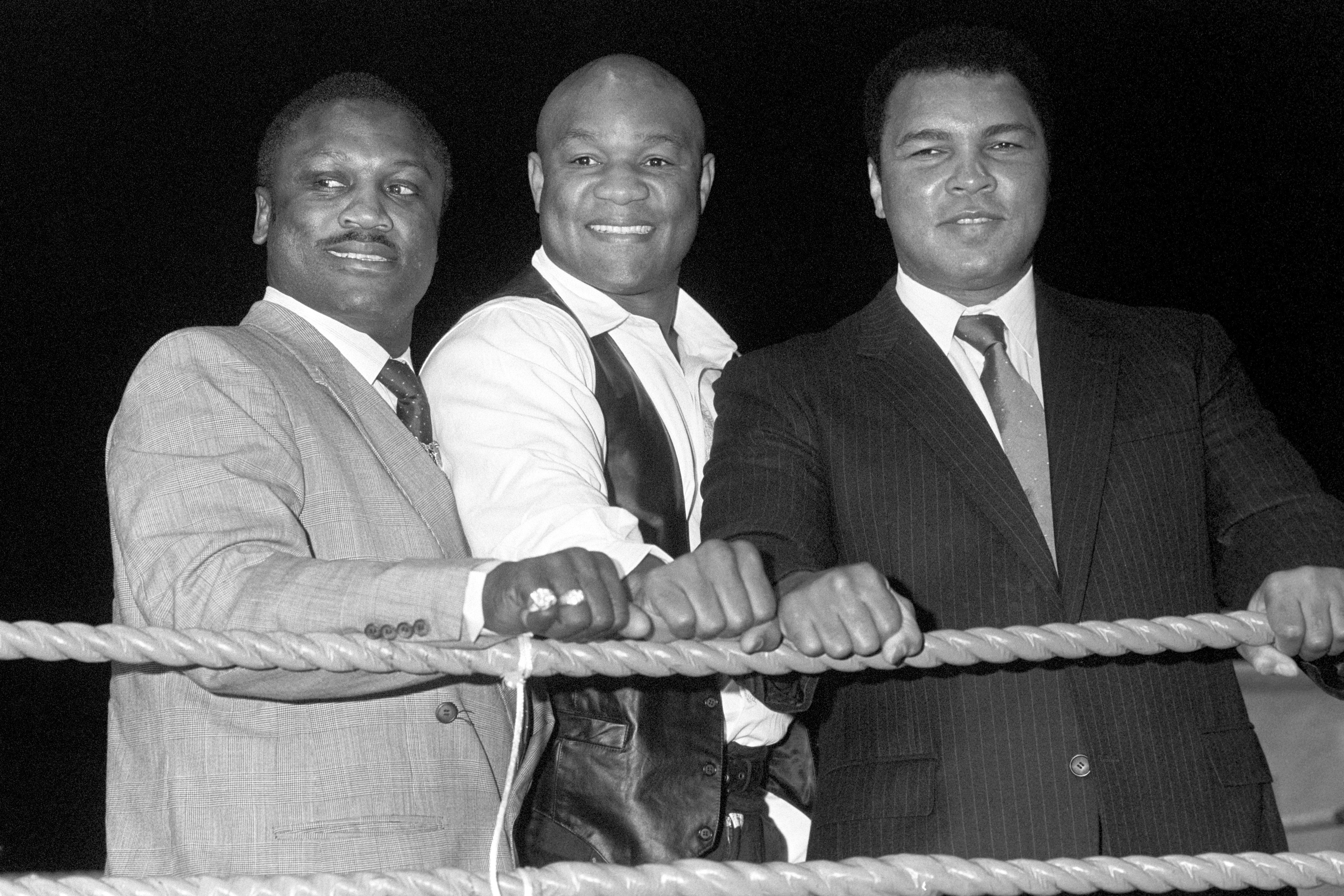 Frazier and Ali with George Foreman (centre), one of their shared opponents, in 1989