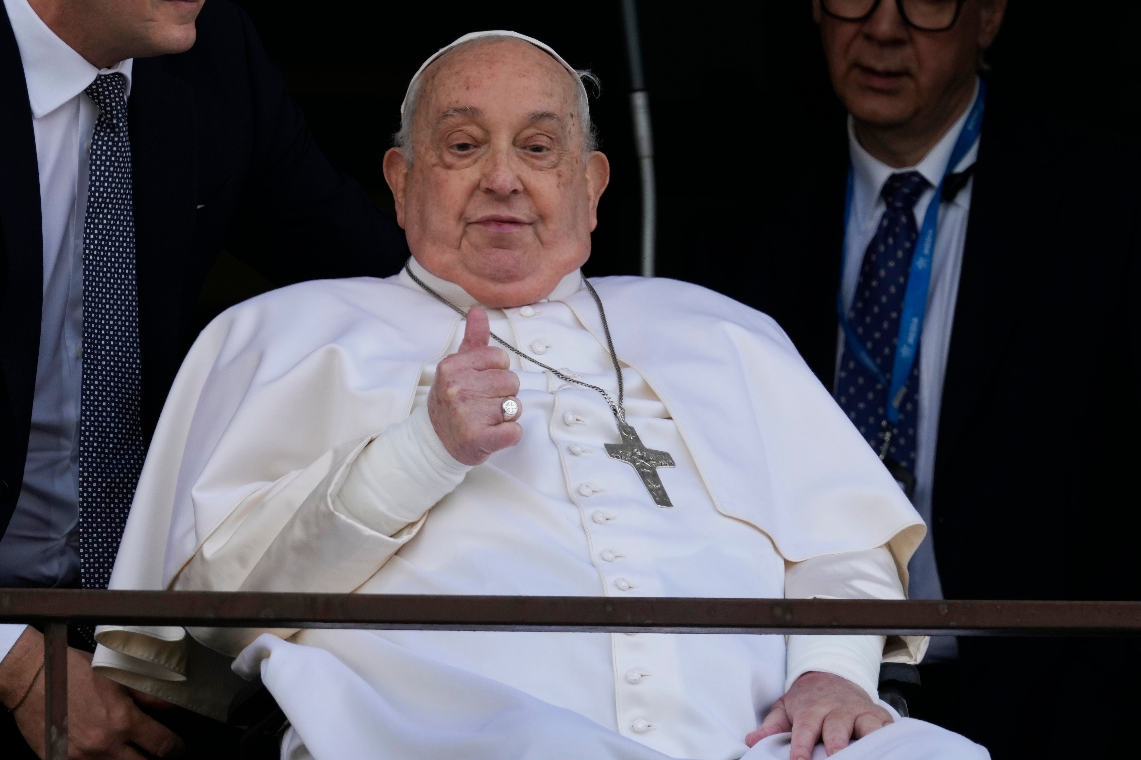 Pope Francis gives a thumbs up during his first public appearance in five weeks
