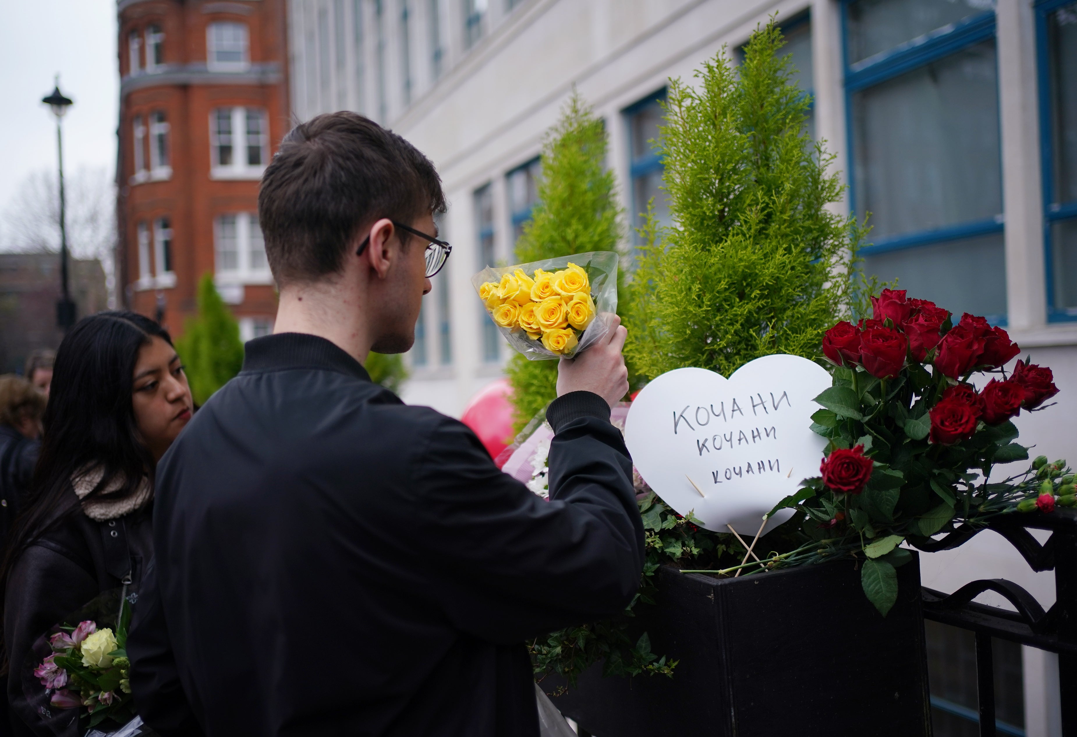 People laid flowers ahead of a vigil (Yui Mok/PA)