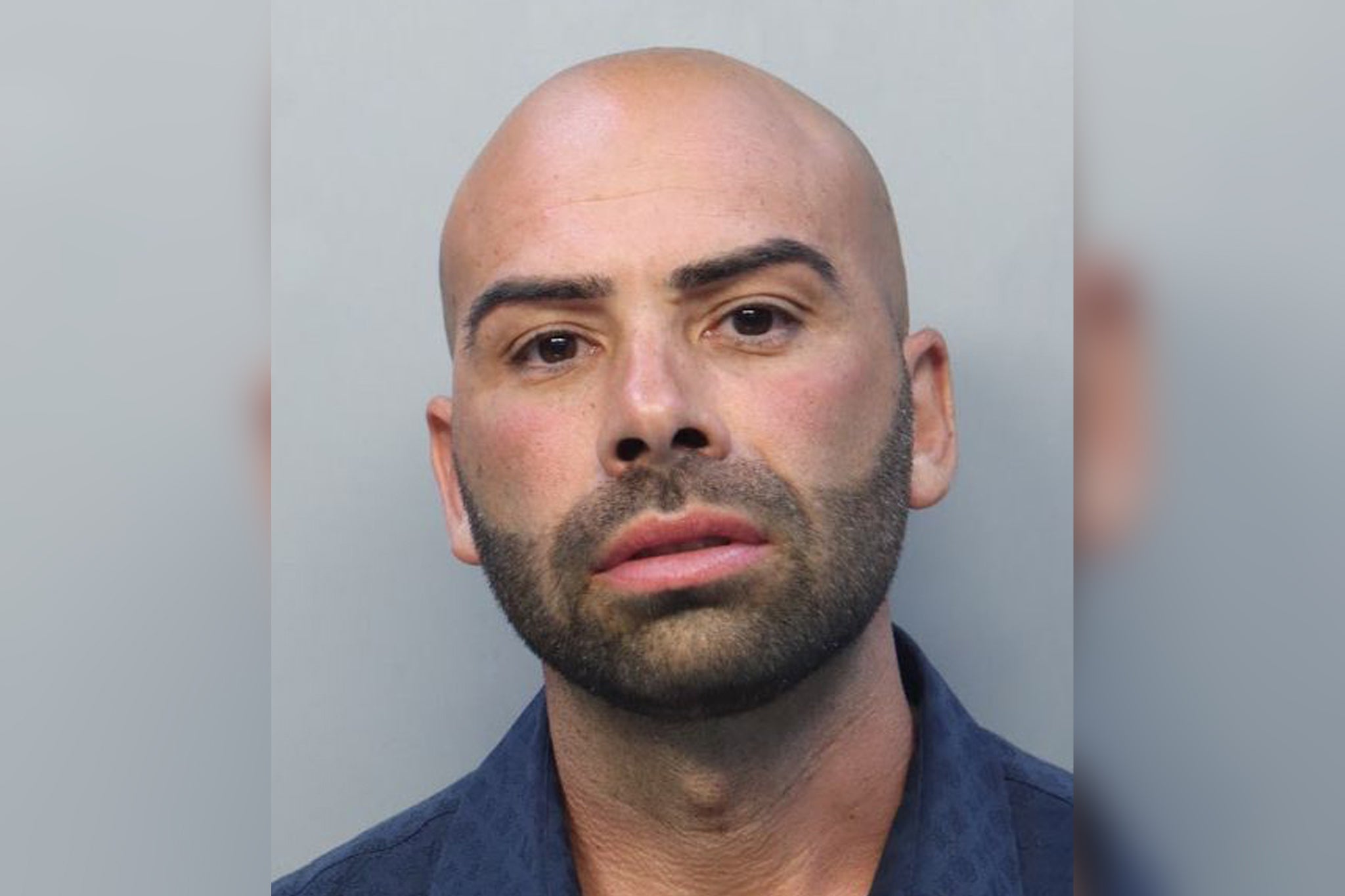 Gene Borrello was arrested in the early hours of Saturday morning and faces stalking and robbery charges