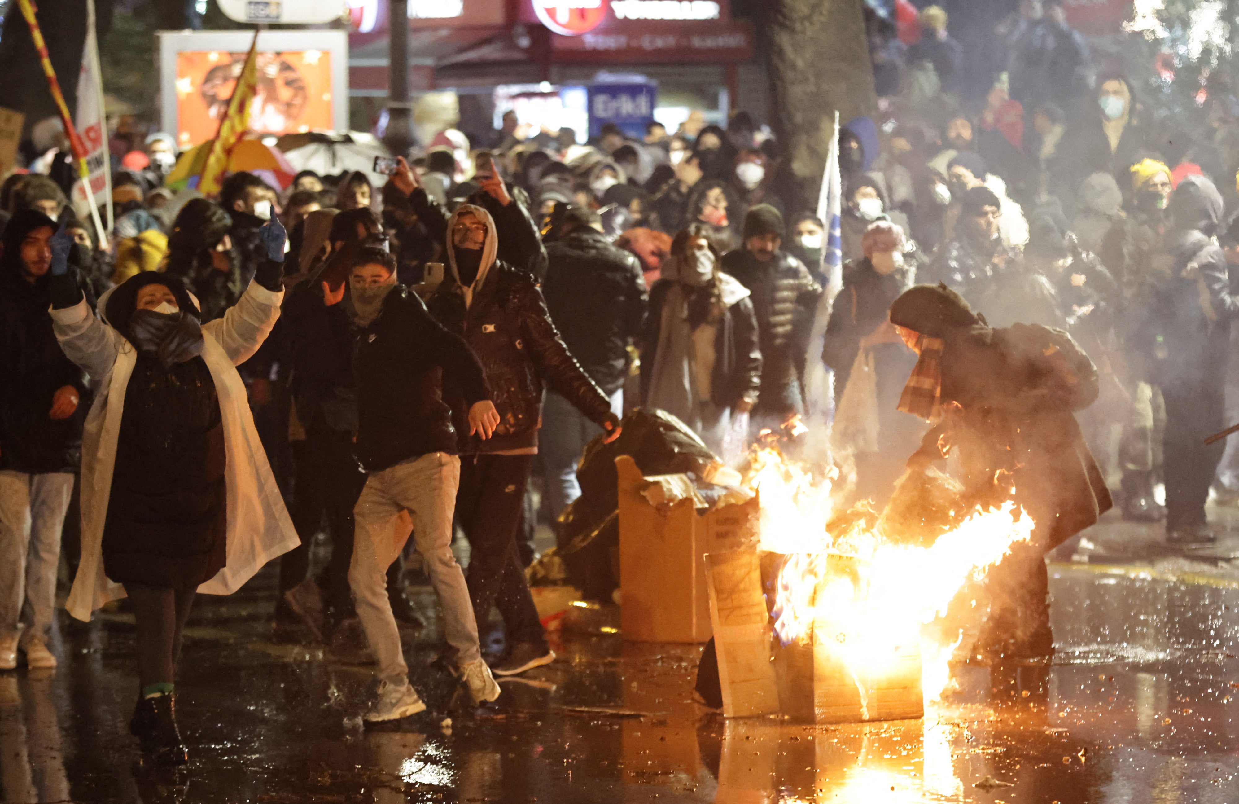 Protesters clash with Turkish anti riot police as they use tear gas and water cannons during a demonstration following the arrest of Istanbul's mayor