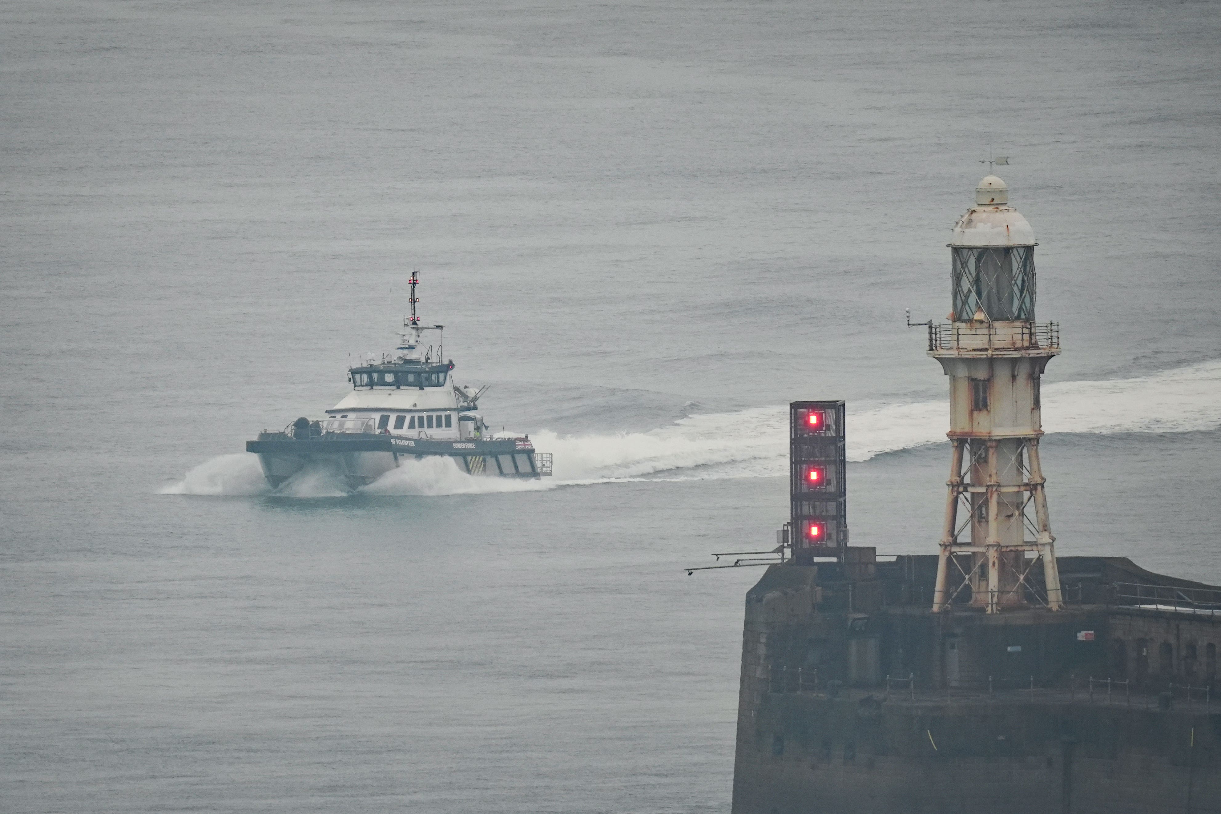 A group of people thought to be migrants are brought in to Dover, Kent, on board a Border Force vessel (Gareth Fuller/PA)