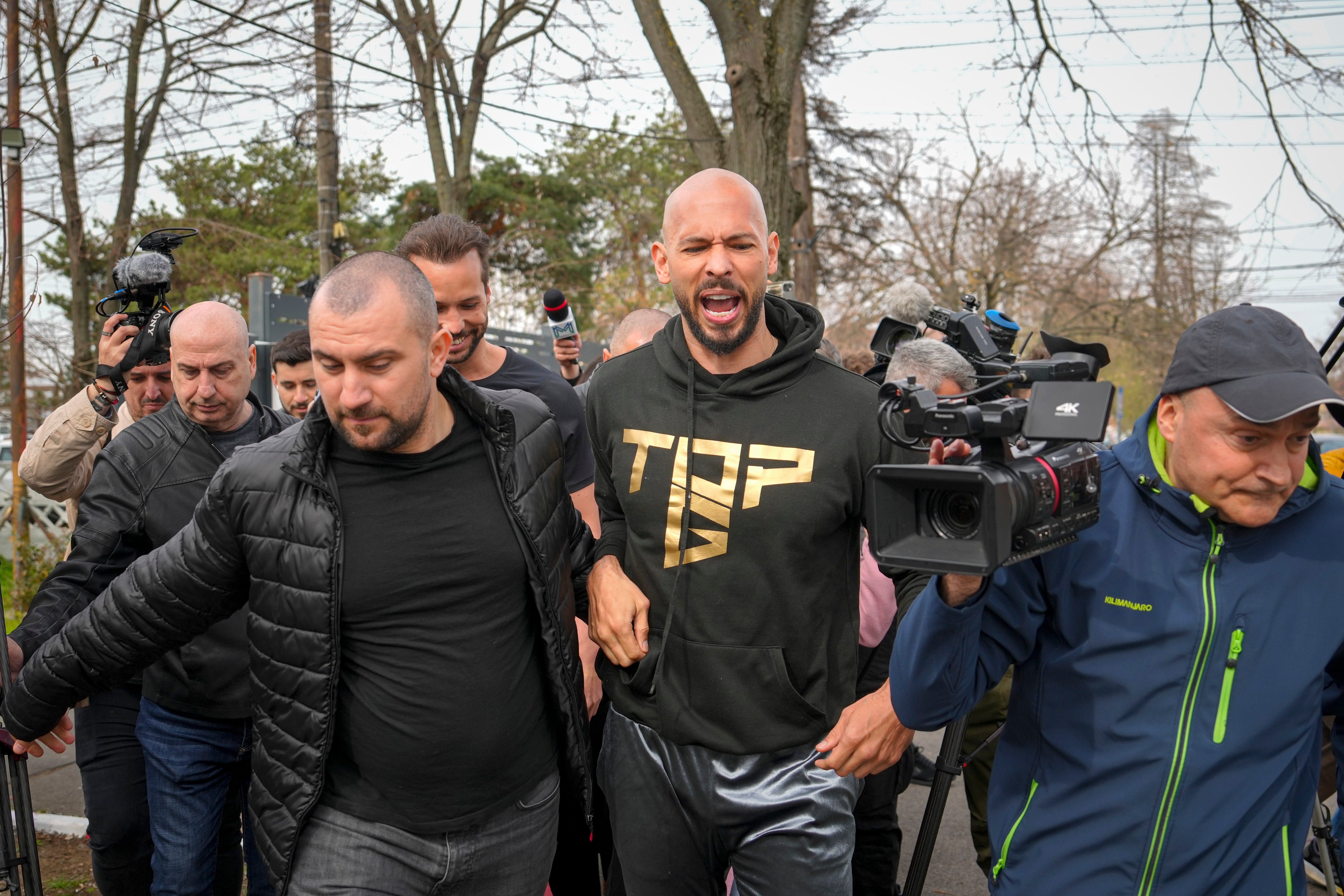 Andrew Tate and his brother Tristan arrived back in Romania Saturday to fulfill their legal obligations regarding an ongoing criminal investigation