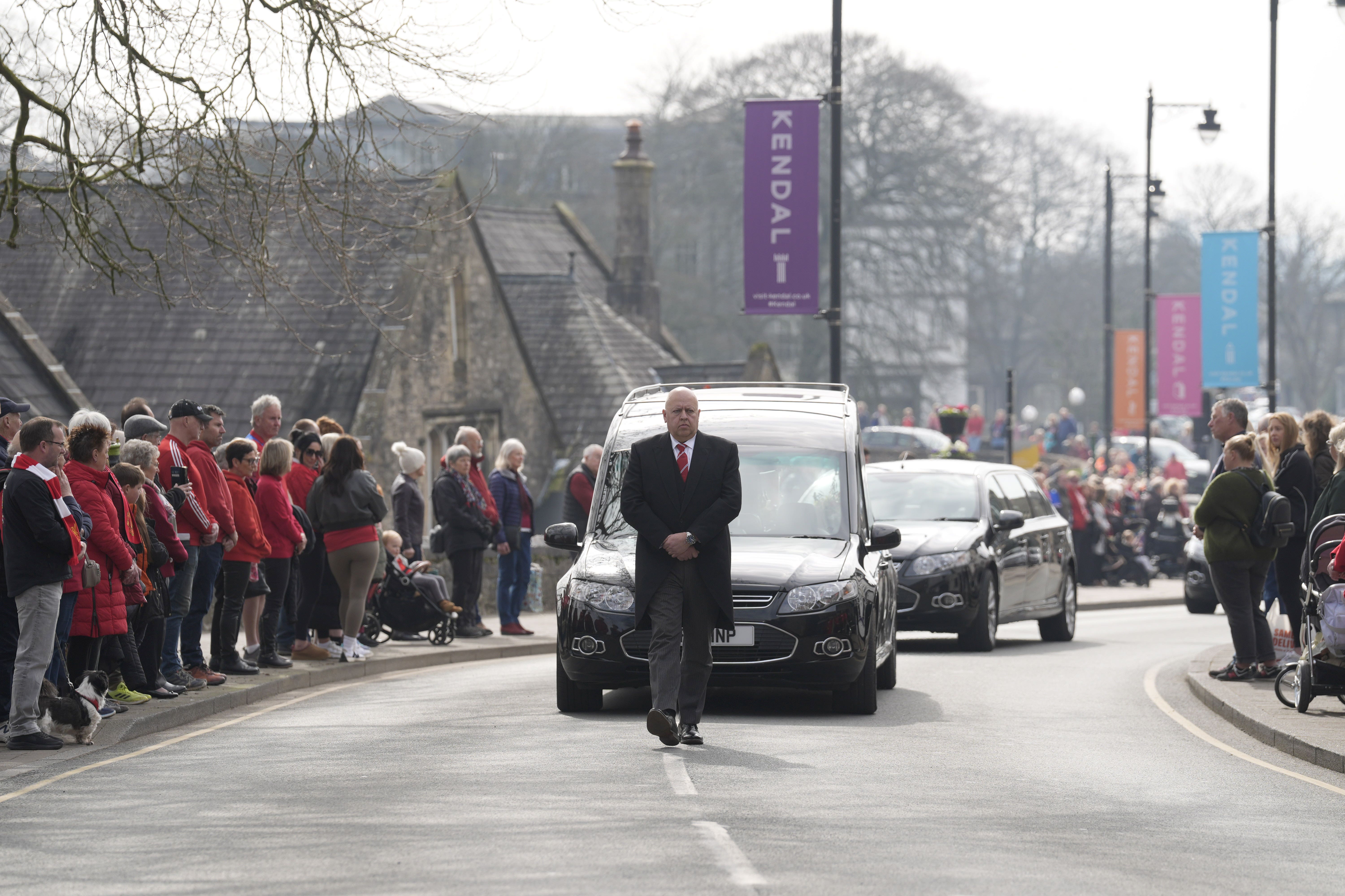 A hearse carrying the coffin of 10-year-old Poppy Atkinson makes its way to Kendal Parish Church ahead of her funeral service (Danny Lawson/PA)