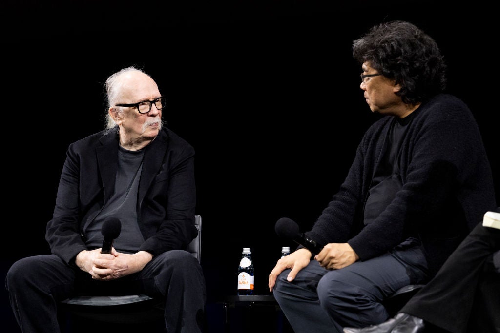 John Carpenter and Bong Joon Ho speak onstage at the Academy Museum special screening of 'The Thing'
