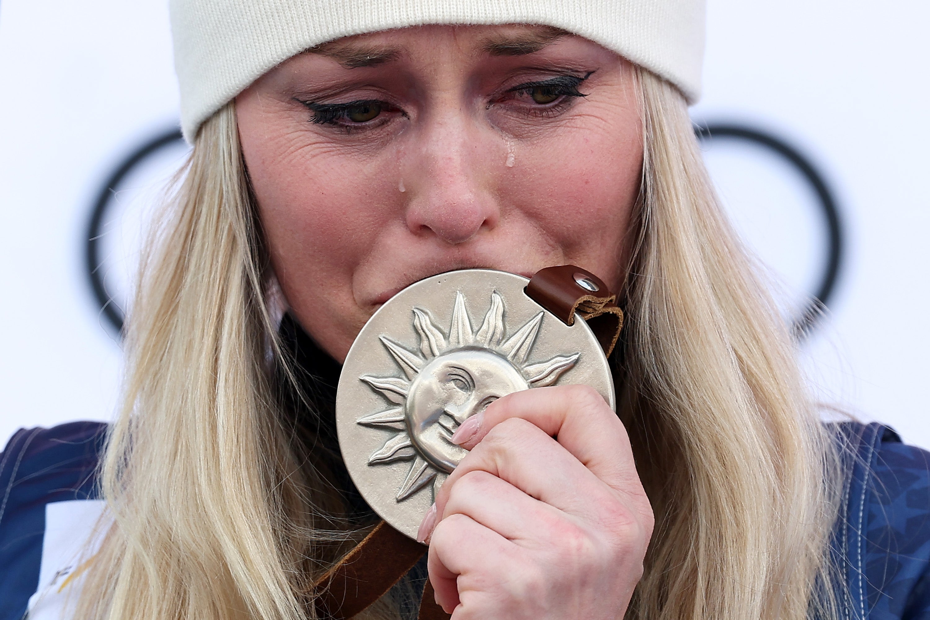 An emotional Lindsey Vonn on the podium after her second-place finish at the 2025 World Cup
