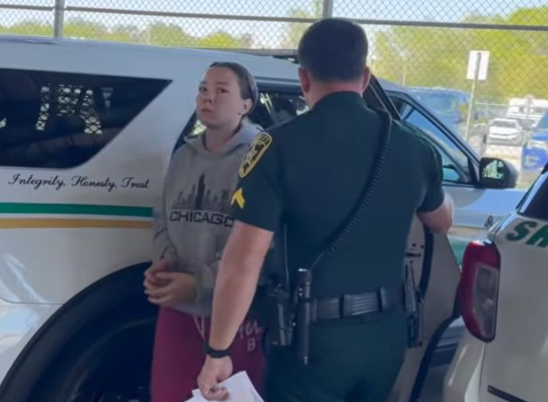 Guminski is marched into Marion County Jail in central Florida