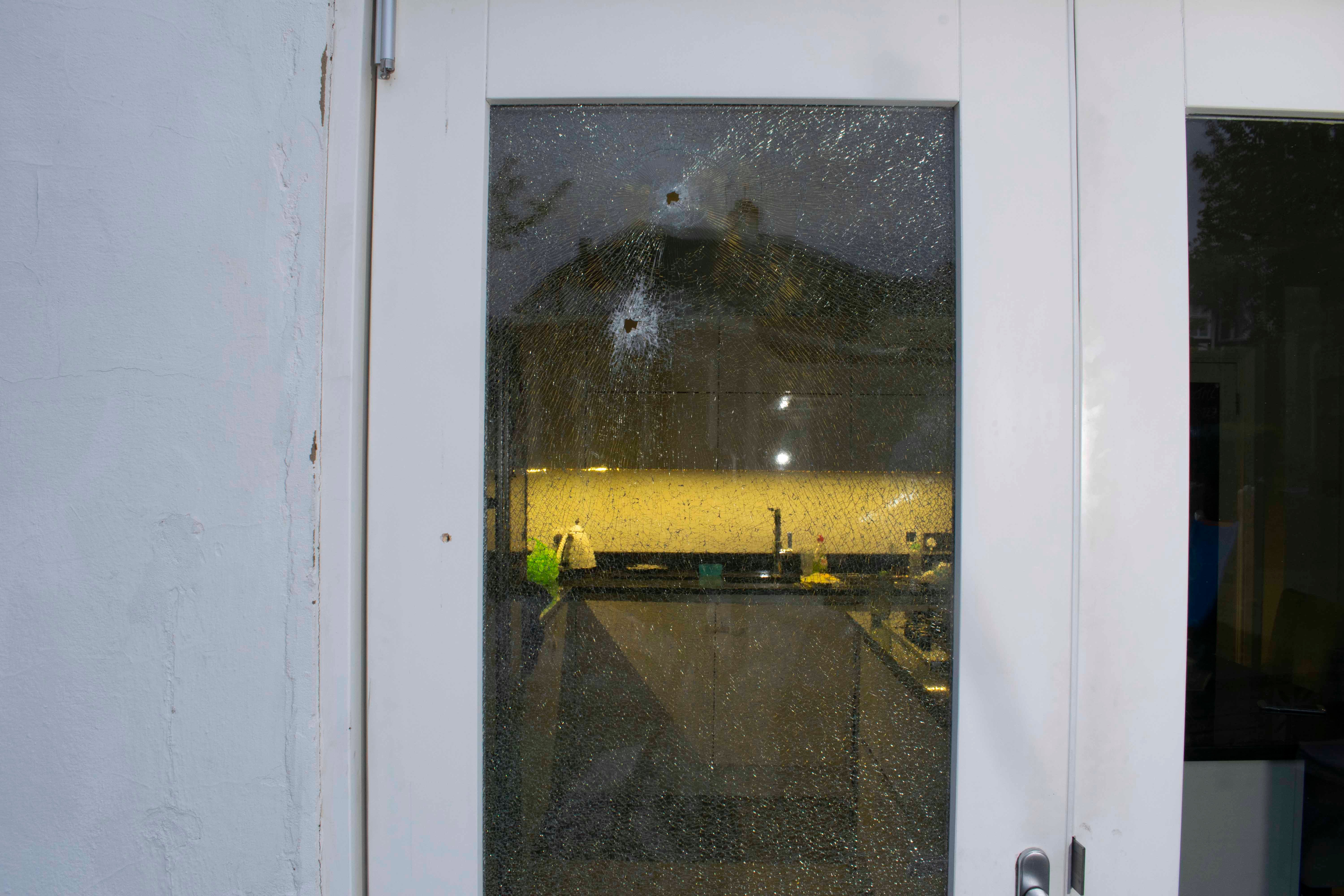 Undated handout photo issued by the Metropolitan Police of the damage to the kitchen door. Three men have been found guilty of plotting to kill a former cagefighter convicted of Britain's largest cash robbery