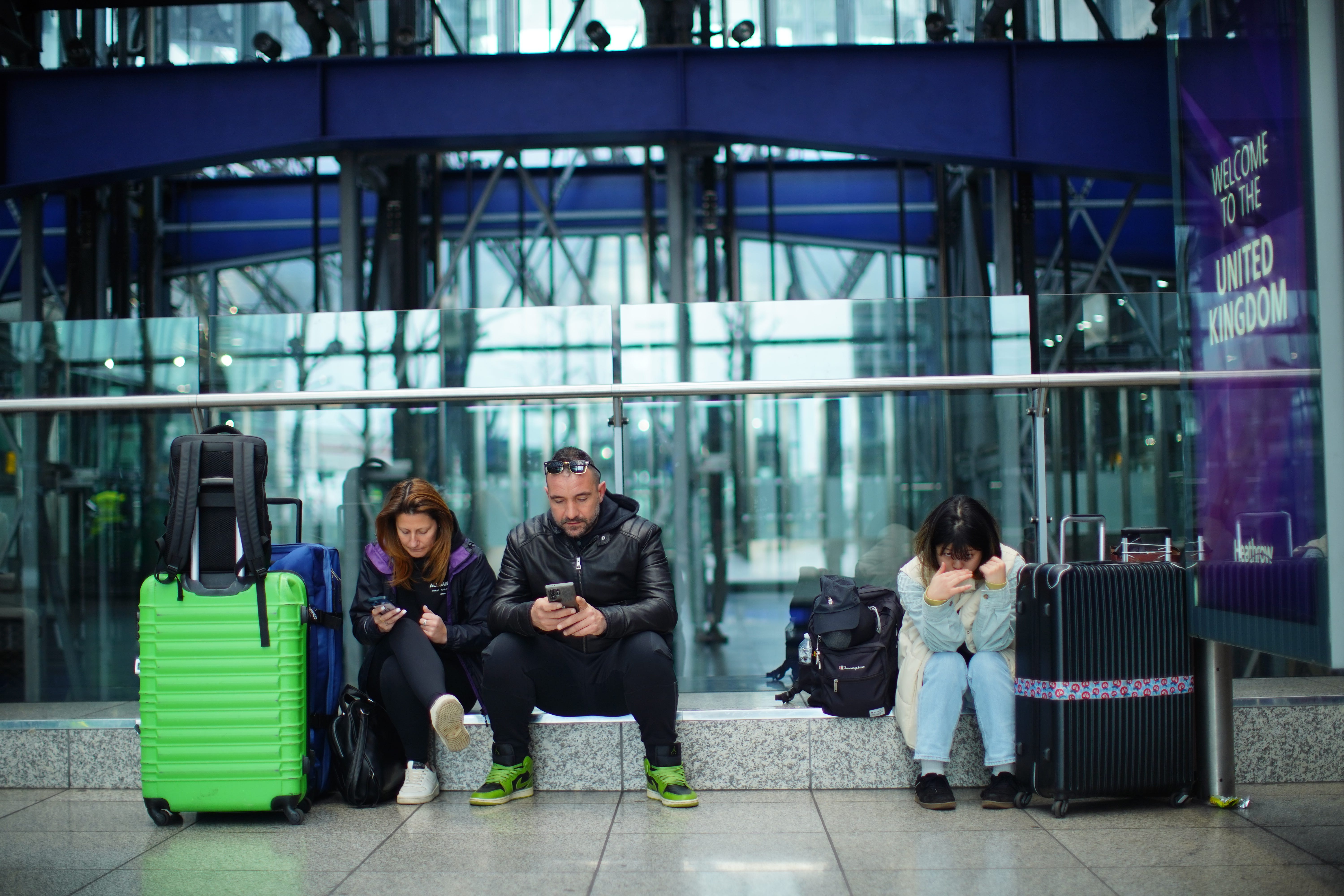 Stranded passengers at Heathrow Terminal 5 (James Manning/PA)