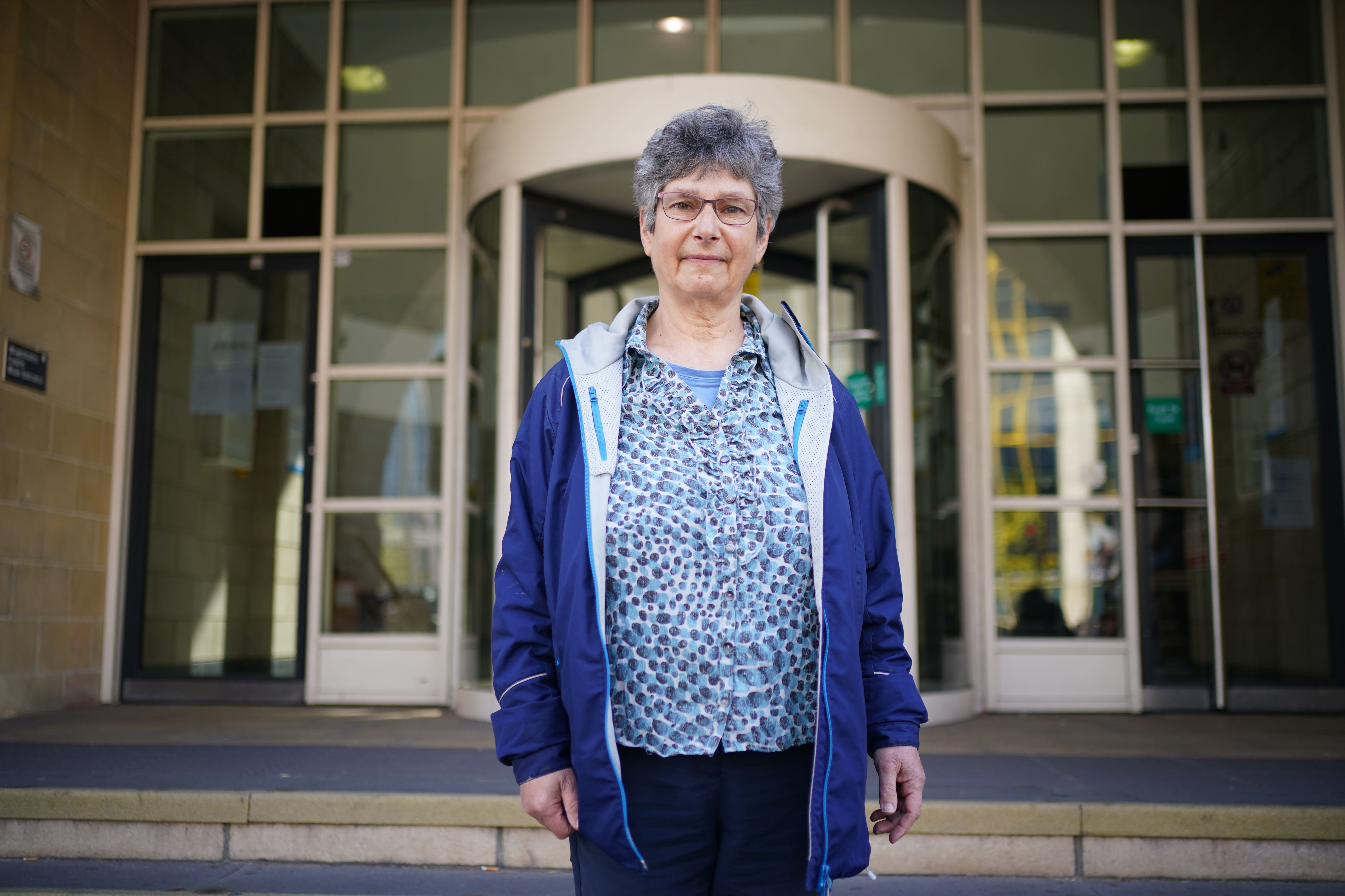 Retired GP Dr Diana Warner, 66, walked down the line outside Drax power station wearing orange high-visibility clothing and waving an orange flag to stop a 400-metre long freight train on December 14, 2021 (Yui Mok/PA)