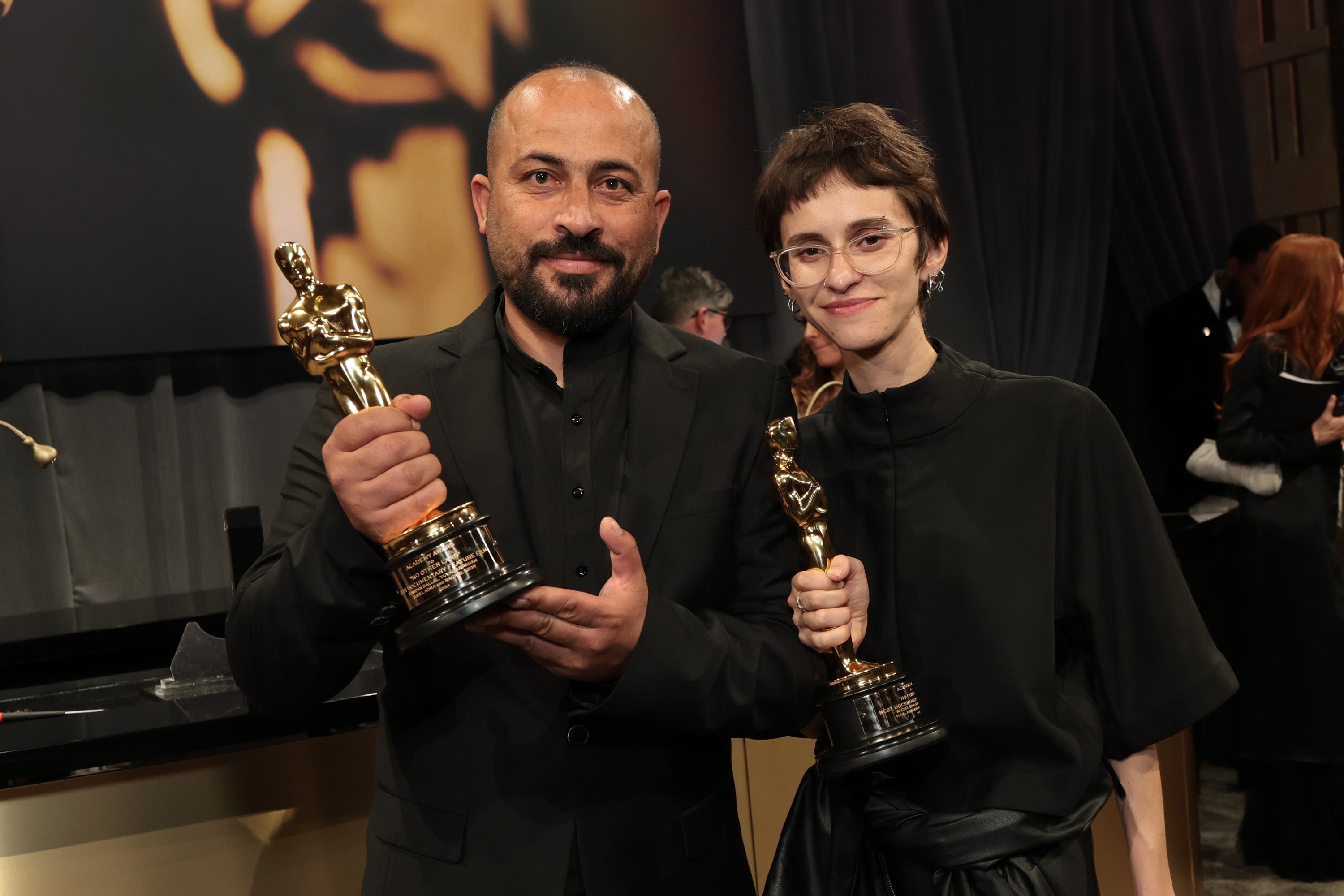 Hamdan Ballal (left) and his ‘No Other Land’ co-director Rachel Szor at the 2025 Oscars