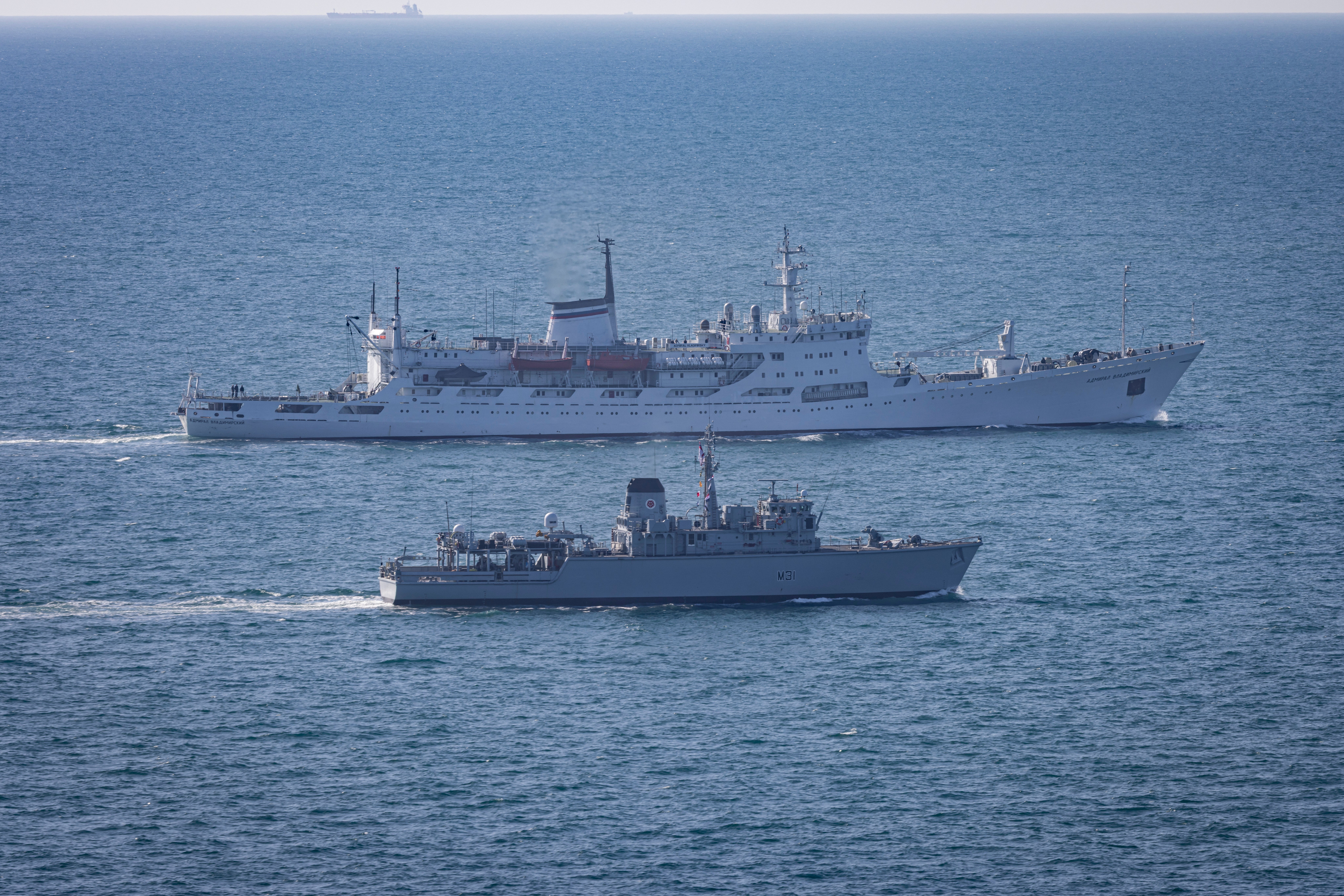 The Russian survey ship Admiral Vladimirskiy was shadowed by Royal Navy Minehunter HMS Cattistock (foreground) through the English Channel