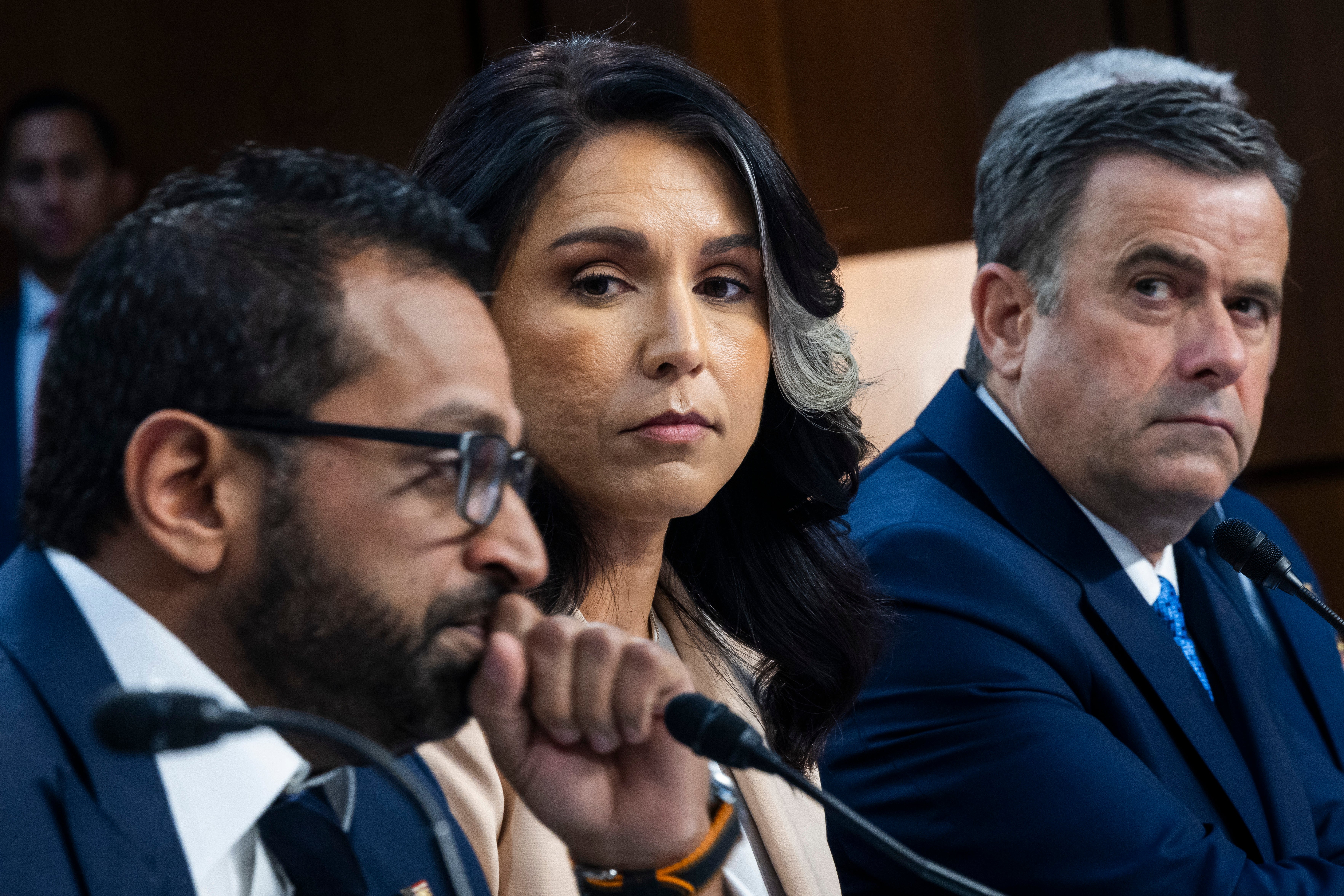 FBI Director Kash Patel testifies at a congressional hearing about the Signal chat group security breach as National Intelligence Director Tulsi Gabbard looks on.