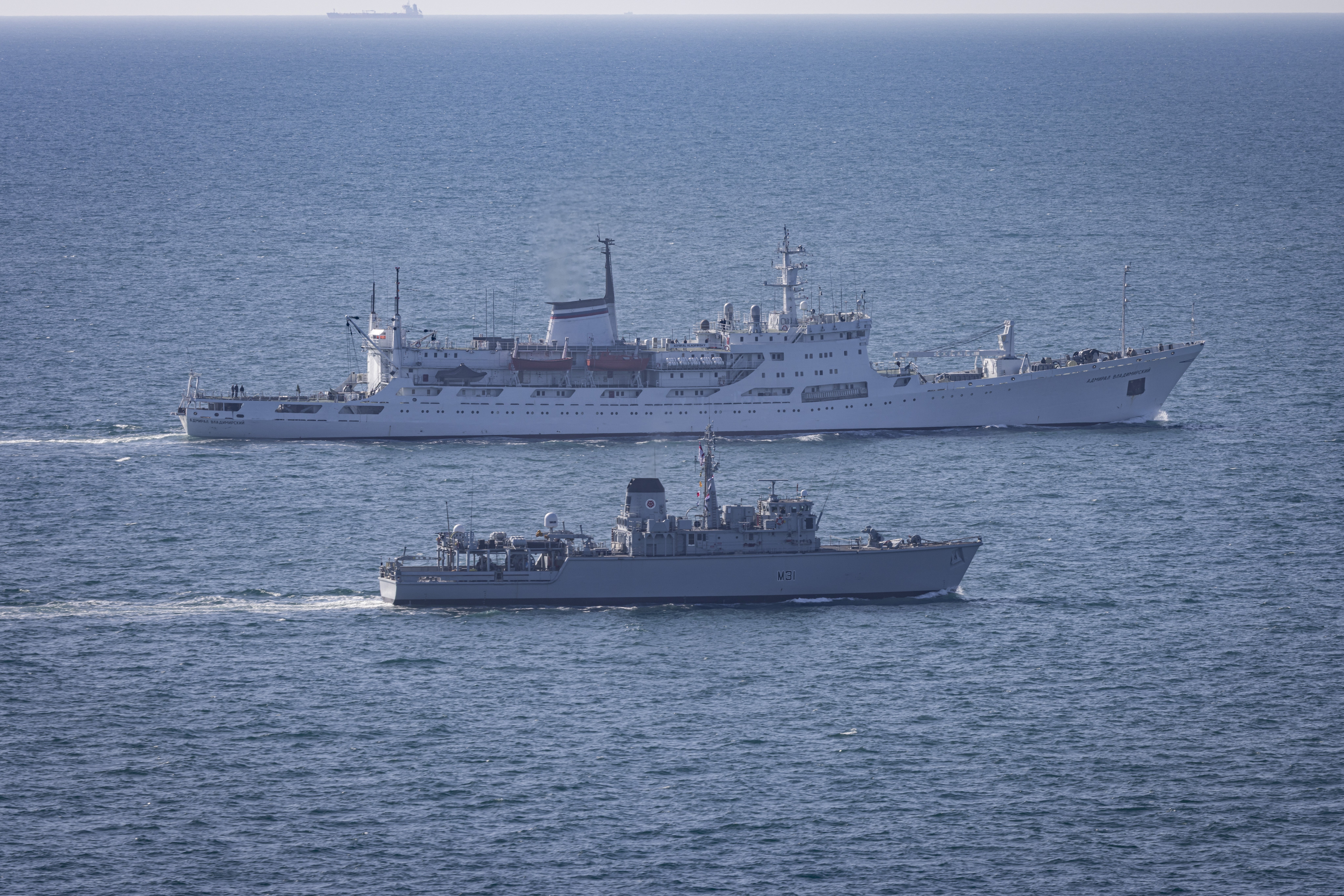Russian survey ship Admiral Vladimirskiy being shadowed by Royal Navy Minehunter HMS Cattistock, in the foreground, through the English Channel