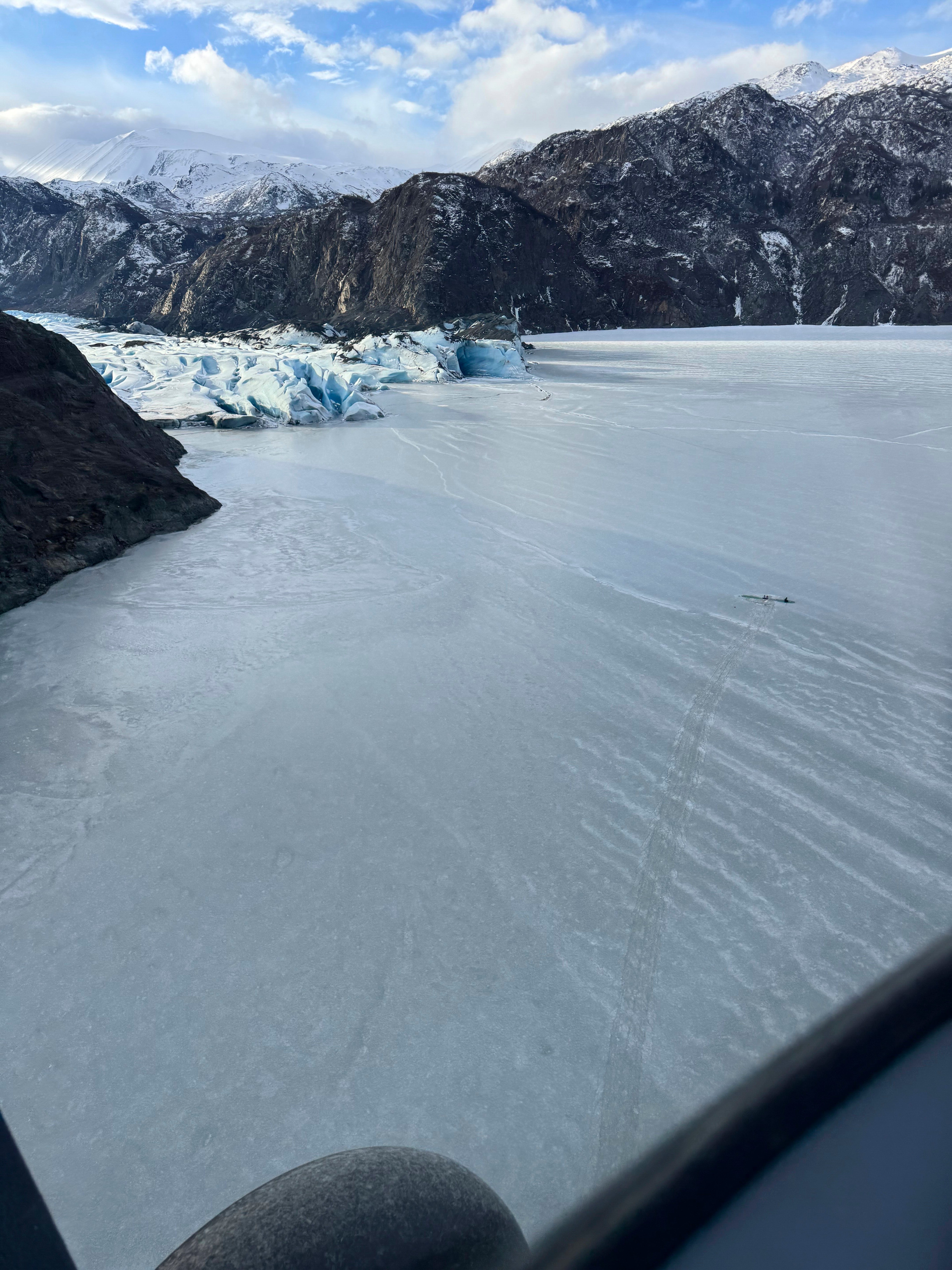 The plane is seen partially submerged in Tustamena Lake in the bottom right of this photo