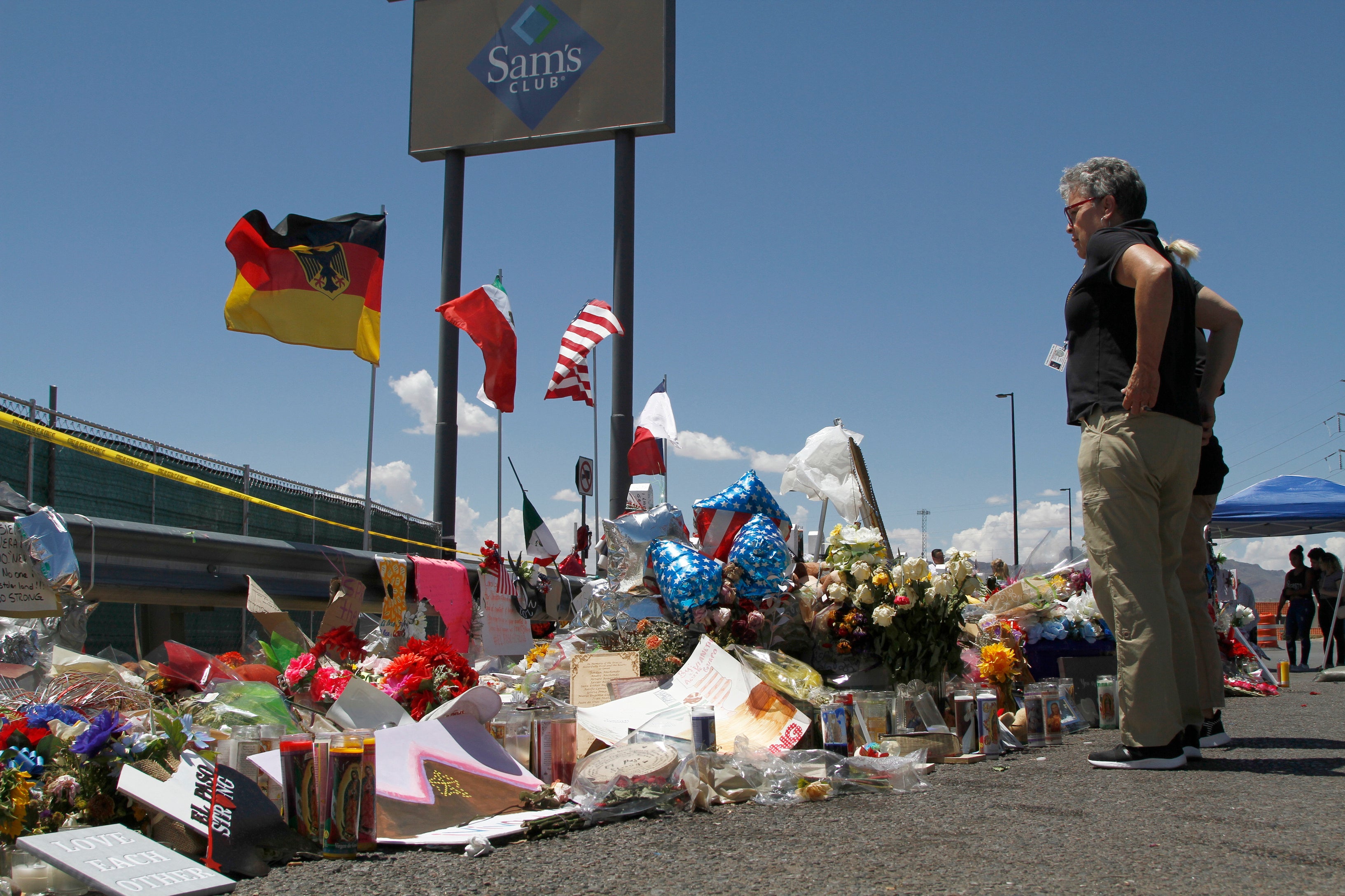Mourners at a makeshift memorial following the shooting
