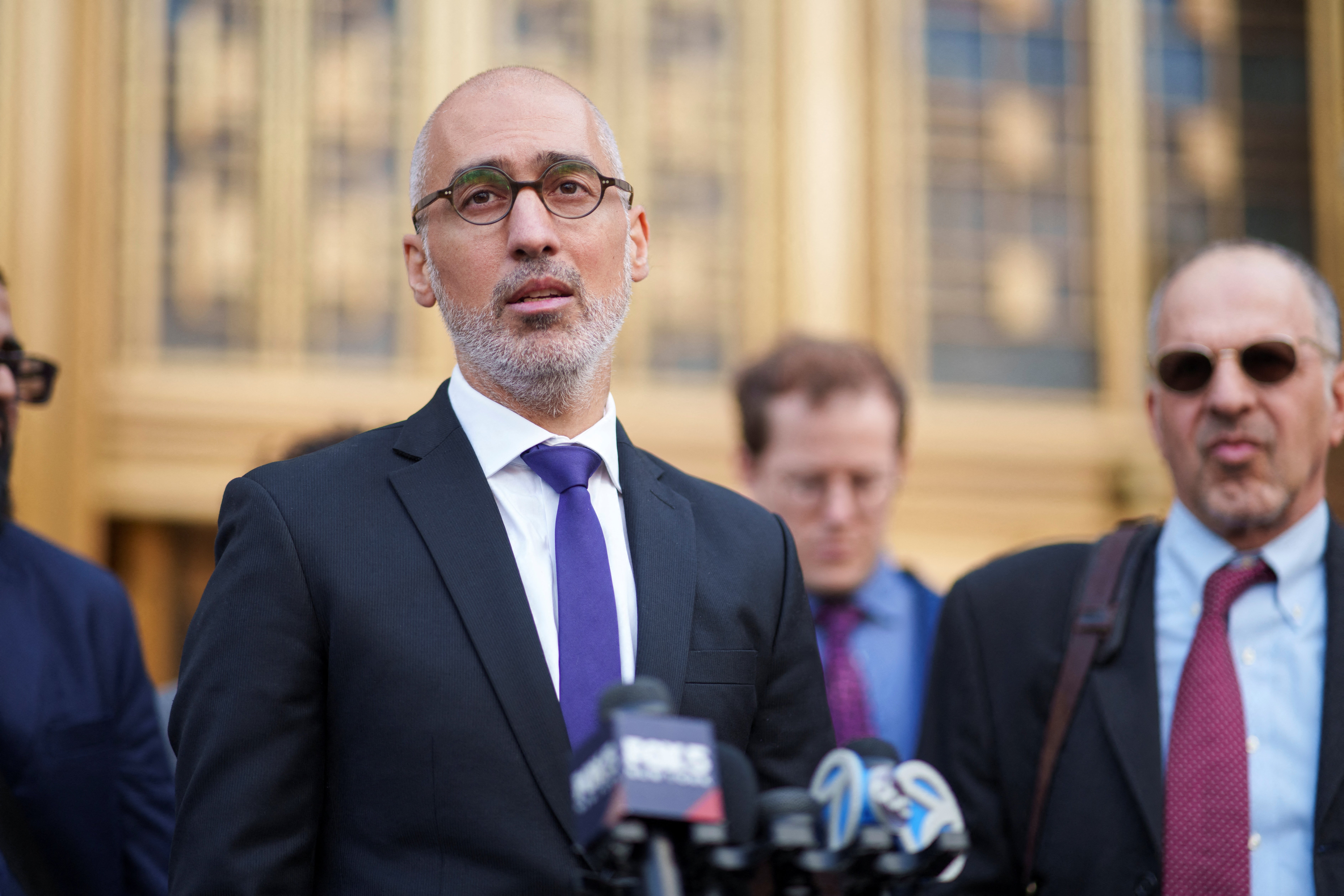 Attorney Ramzi Kassem speaks to reporters outside Manhattan federal court March 25 after a judge granted a temporary restraining order that blocks the Trump administration from deporting Columbia student Yunseo Chung while her legal challenge plays out