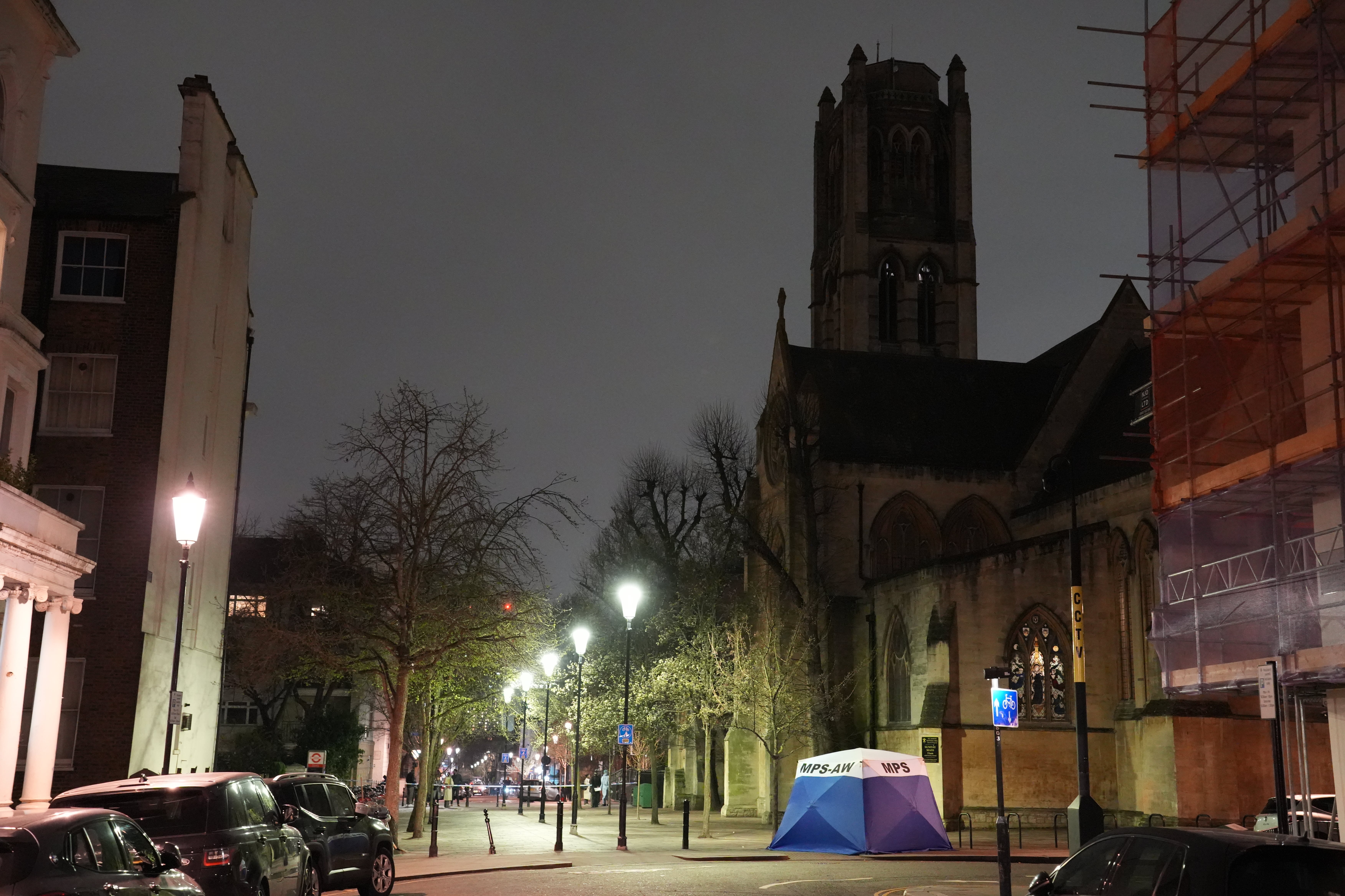 Forensic officers in Notting Hill after a baby’s body was found in a bag outside All Saints’ Church