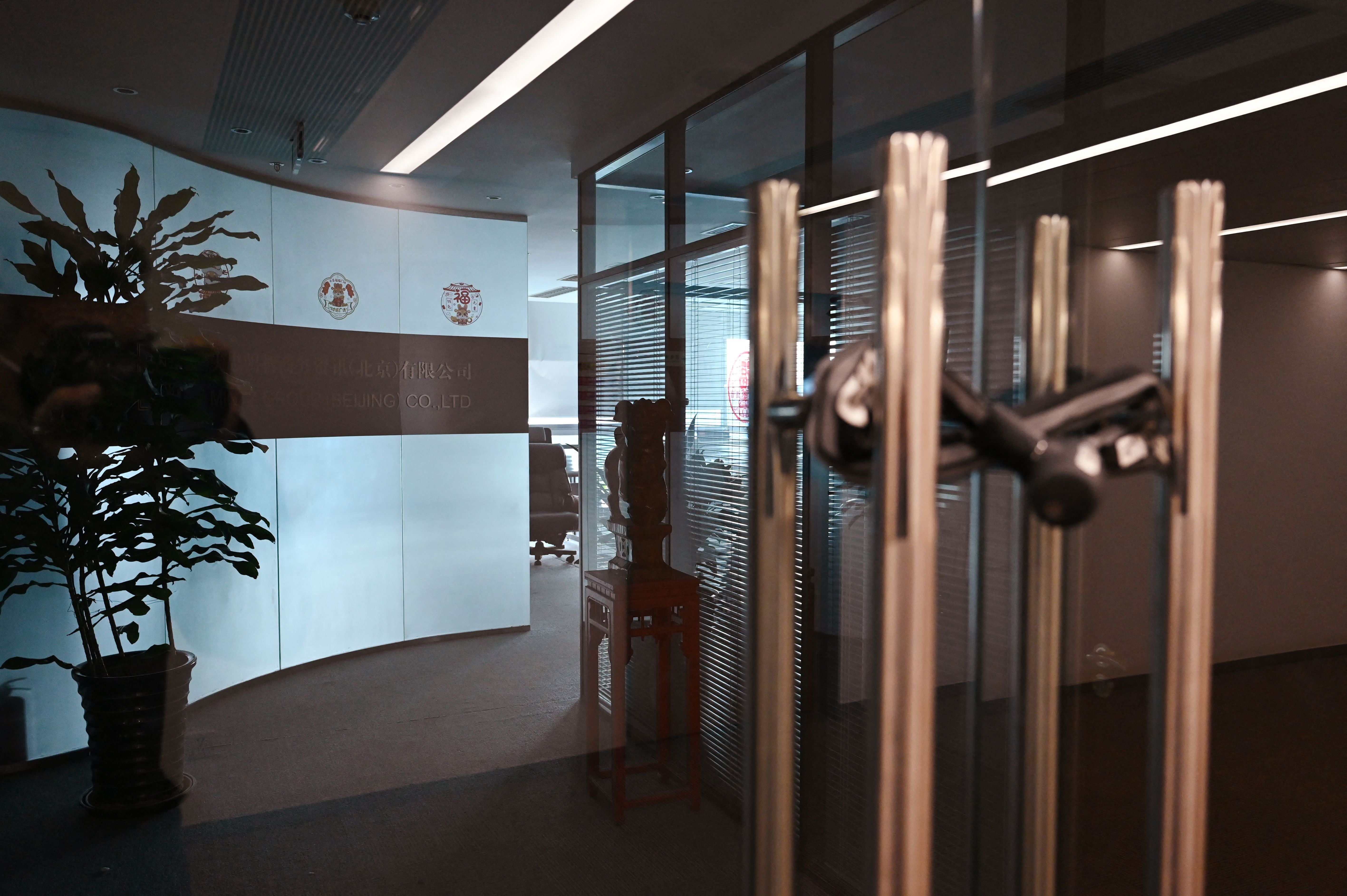 File. The closed office of the Mintz Group is seen in an office building in Beijing on 24 March 2023