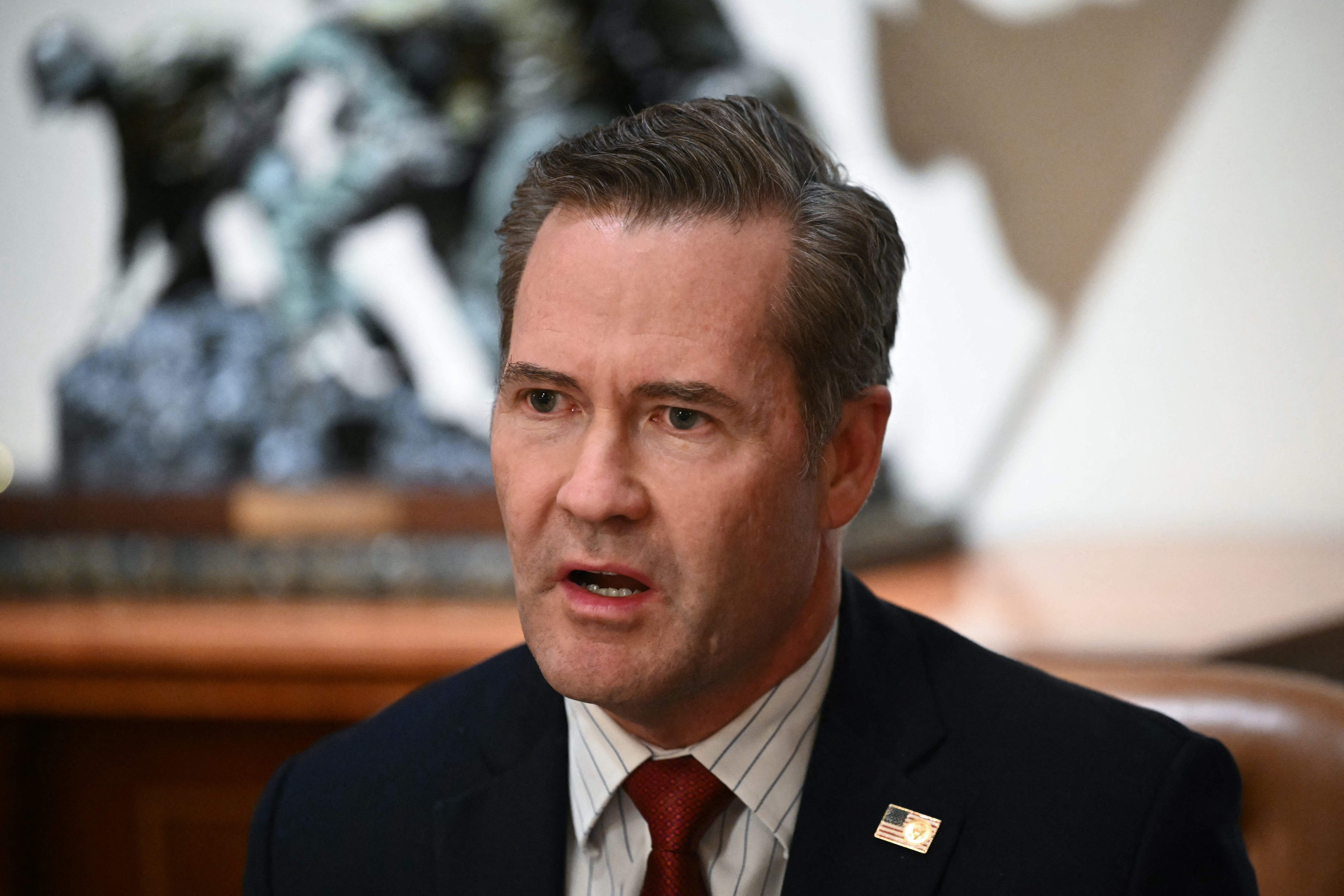 Donald Trump has shifted the blame for a security blunder that shared details of a U.S. military operation in Yemen with a journalist on a secret group chat to a ‘lower level’ White House employee that worked for his National Security Adviser Michael Waltz (pictured)