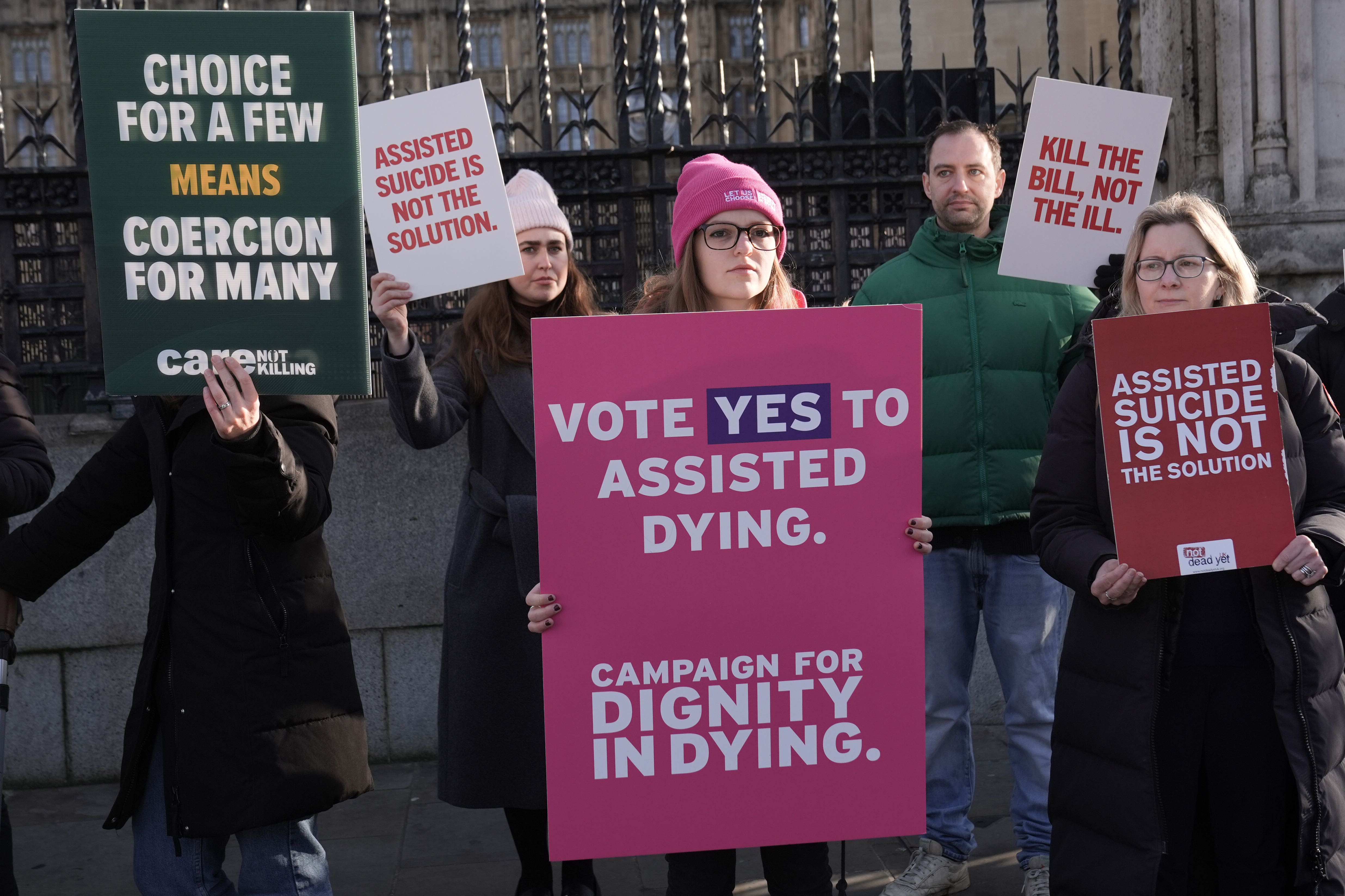 Proponents and opponents of the Terminally Ill Adults (End of Life) Bill demonstrating outside Westminster last year (Stefan Rousseau/PA)