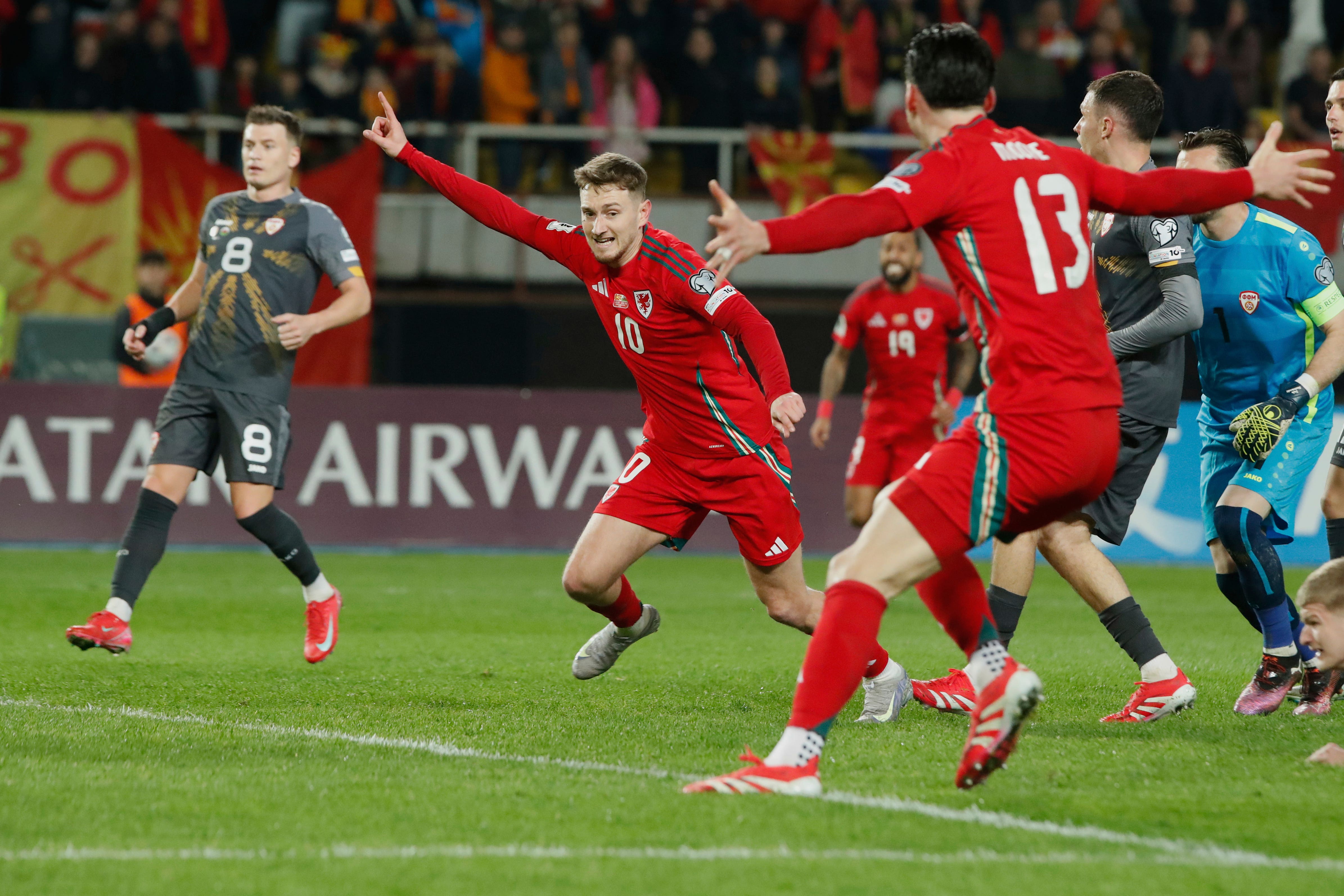 Wales forward David Brooks (second left) celebrates his last-gasp equaliser in their World Cup qualifier against North Macedonia in Skopje (Boris Grdanoski/AP)