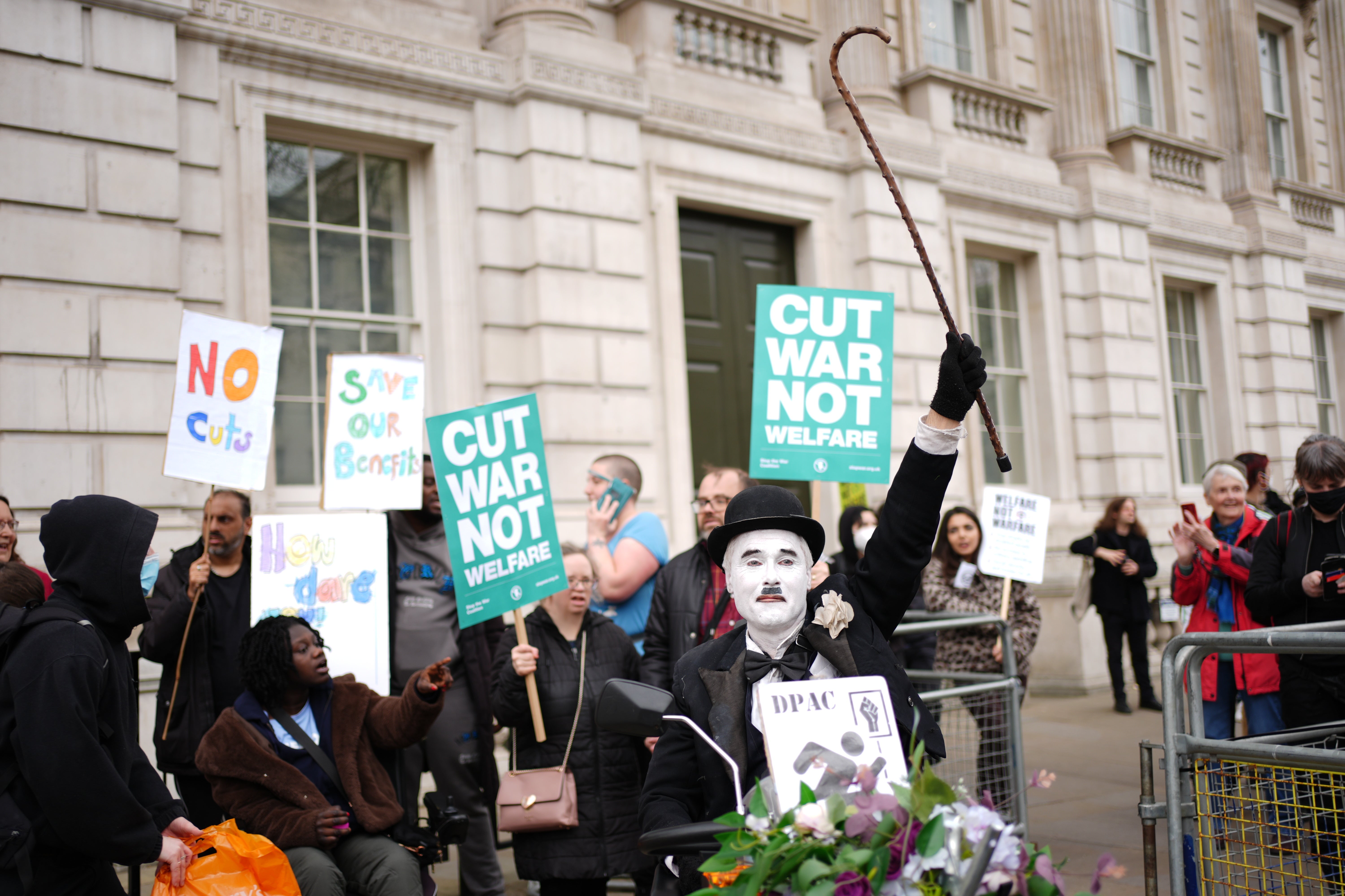 Protesters chant: ‘No more deaths from benefit cuts’, March 2025 (PA)