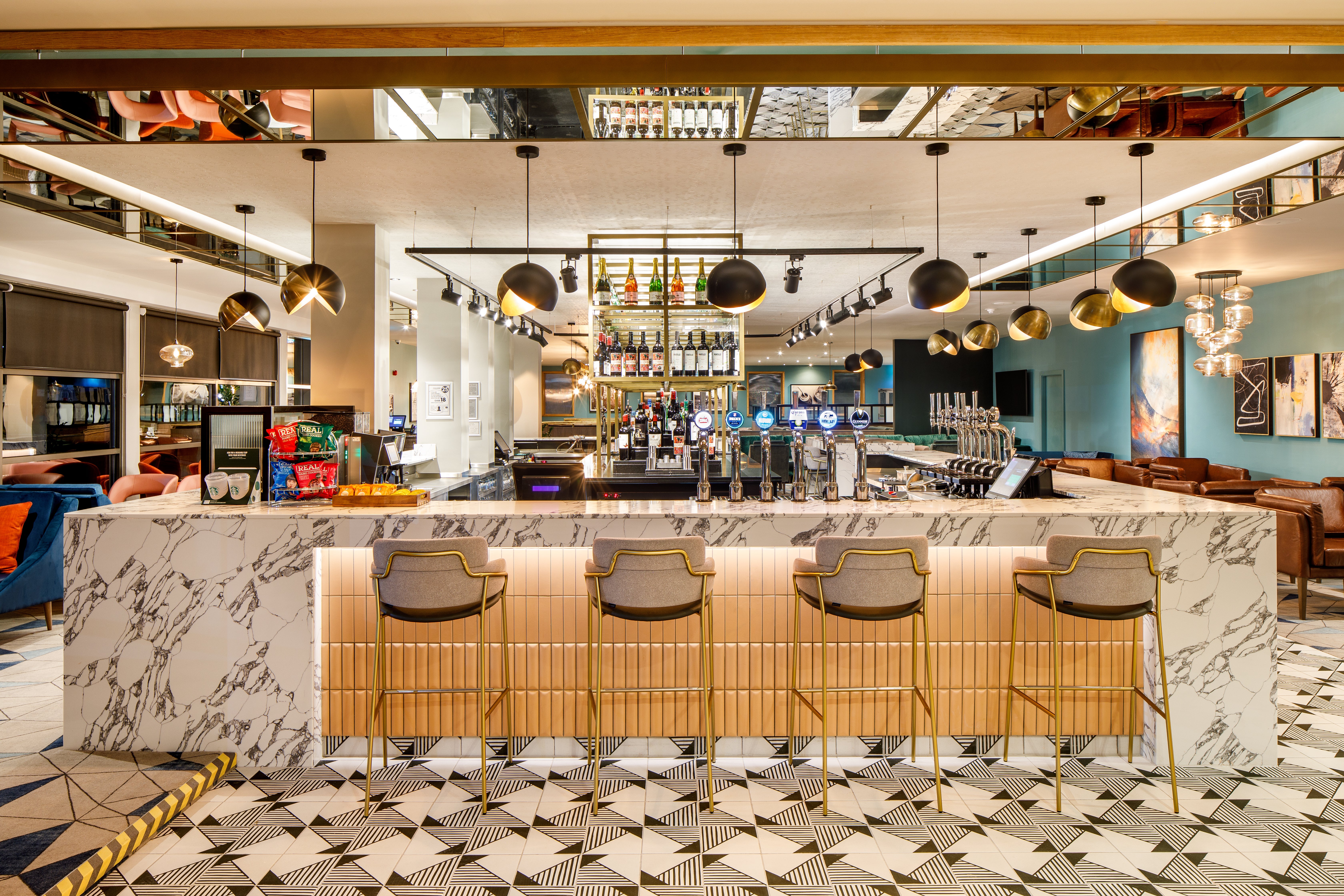 Seek out the marble-wrapped bar serving drinks all day at Crowne Plaza