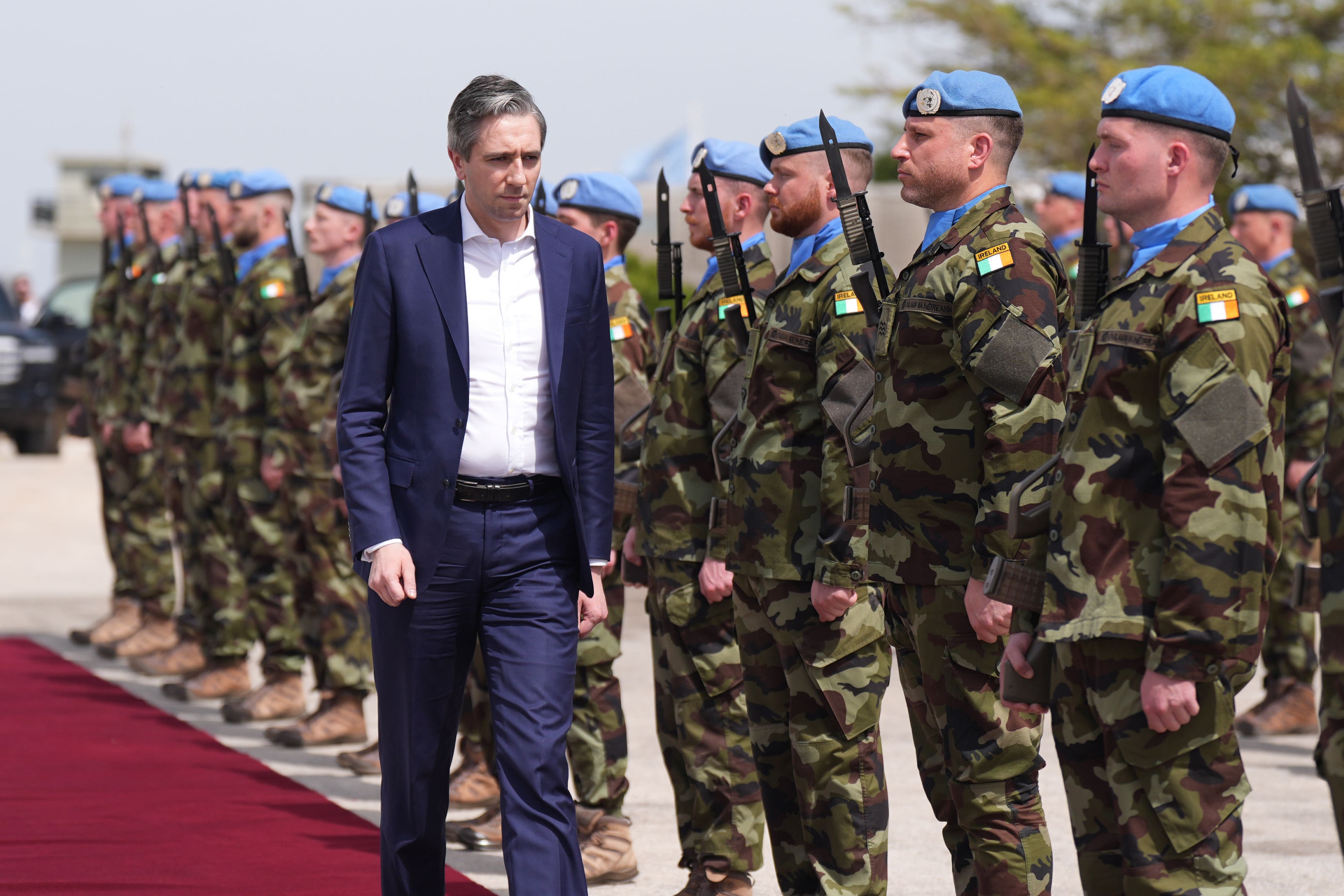 Tanaiste Simon Harris reviews troops at Camp Shamrock in Lebanon (Niall Carson/PA)