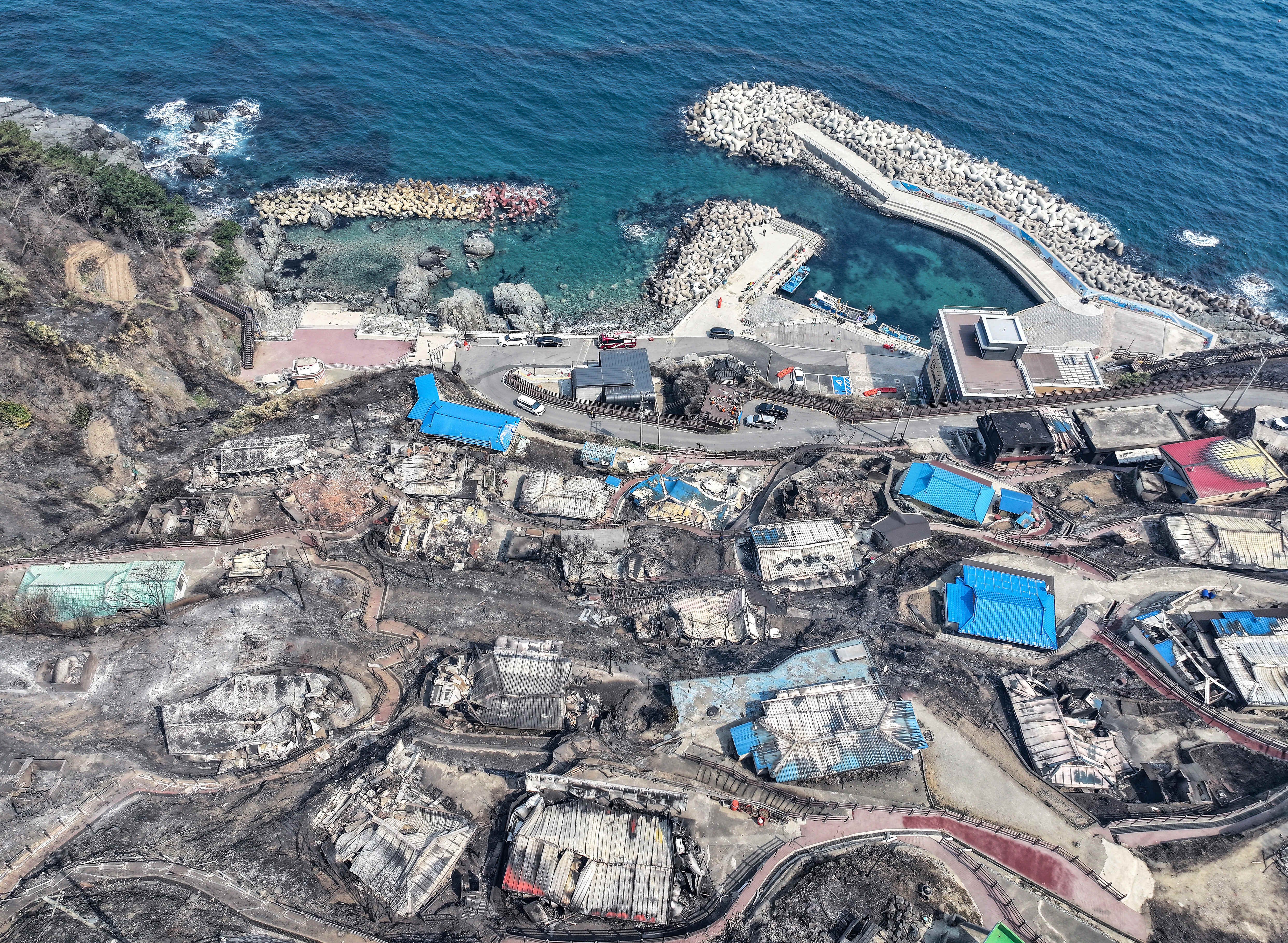urnt-out houses are seen at a damaged village due to wildfires in Yeongdeok, South Korea
