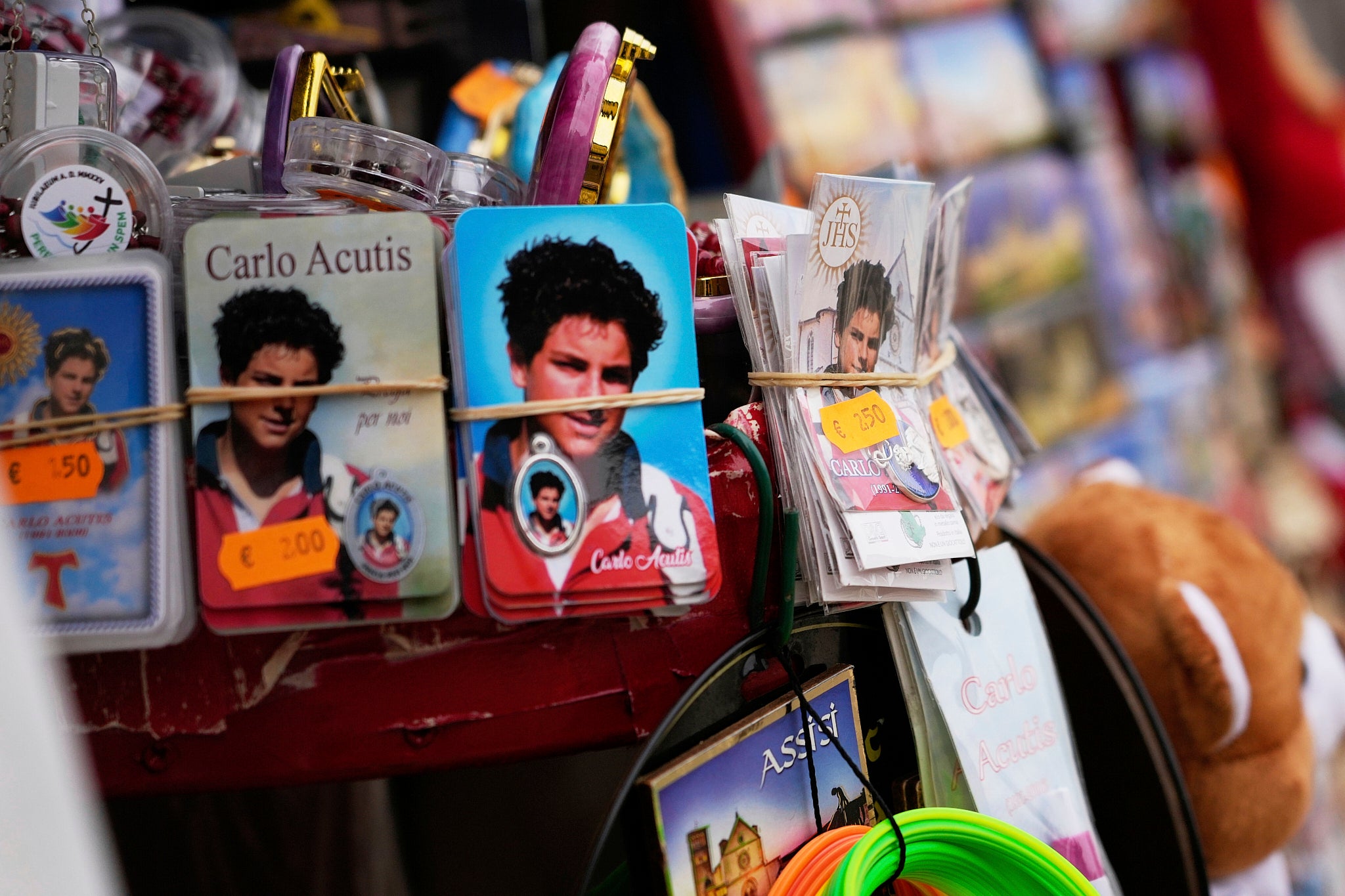 Pictures of Carlo displayed at a kiosk in Assisi