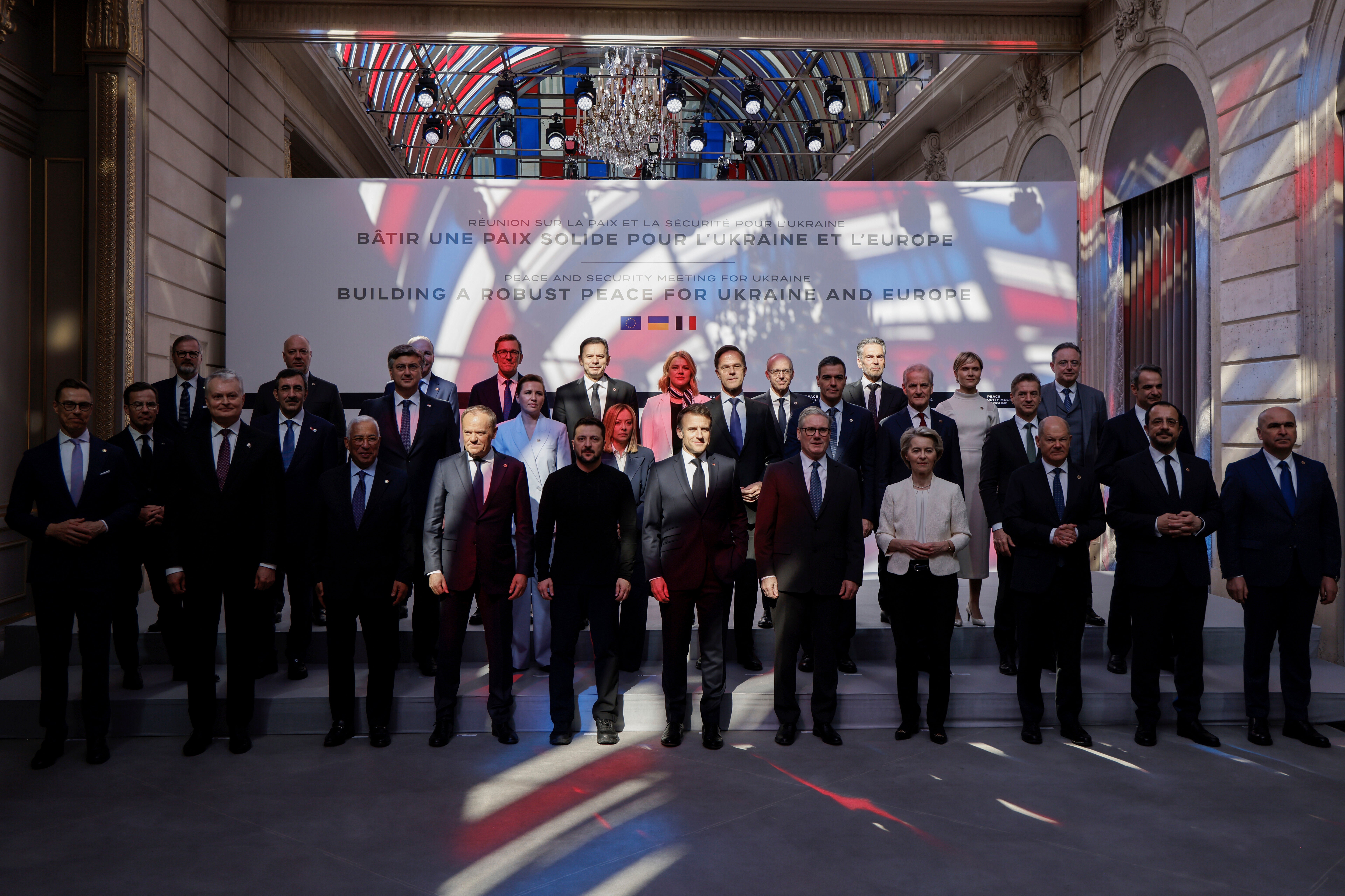 Officials pose as part of the so-called "Coalition of the willing" summit at the Elysee Palace