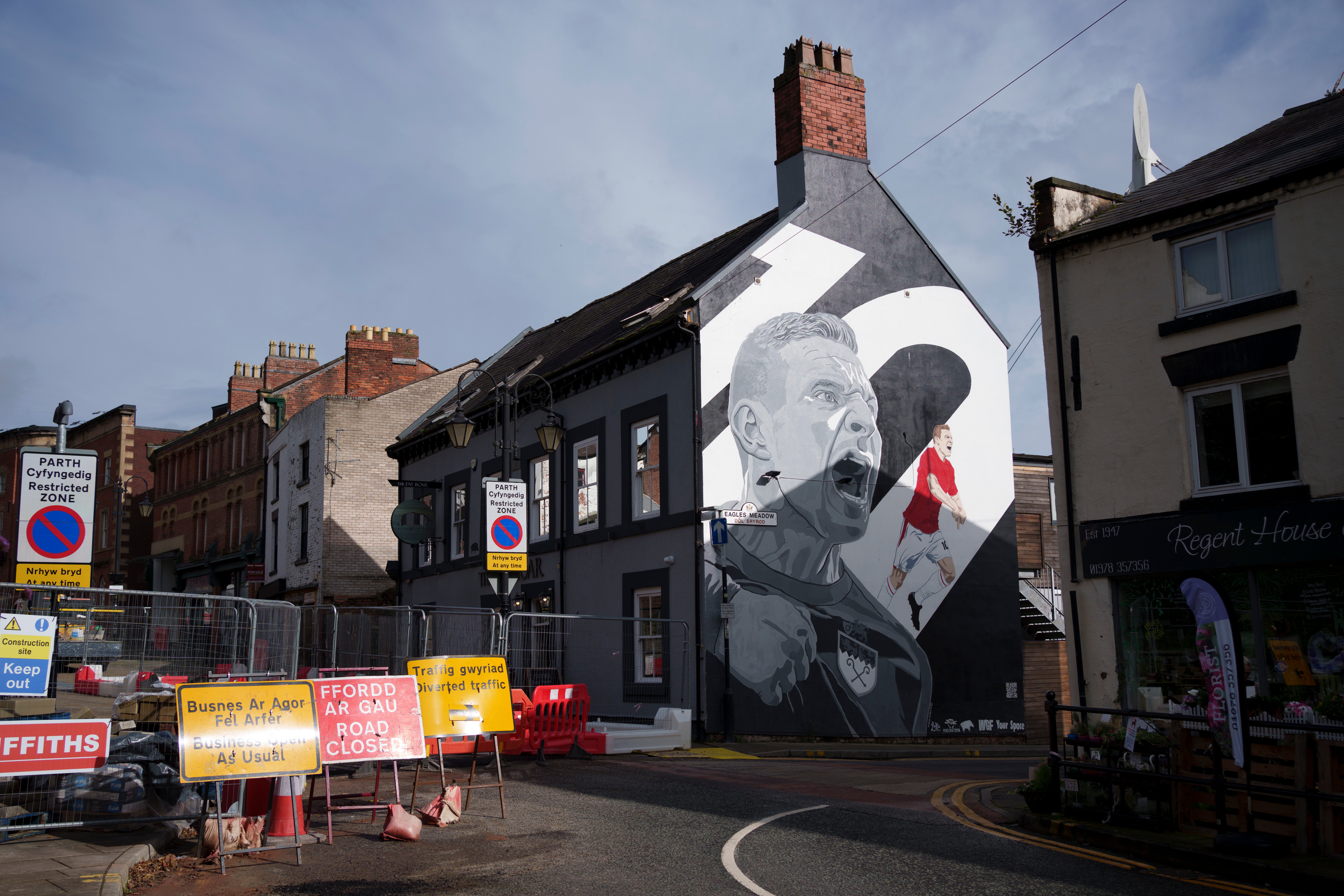 FILE - A mural of Wrexham soccer club's star striker Paul Mullin is visible in the center of Wrexham, Wales, Monday, Oct. 7, 2024