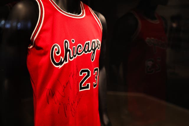 <p>Michael Jordan's Chicago Bulls 1984-1985 game-worn and signed 'Preseason Debut' rookie jersey is on display during a public exhibition at Sotheby's New York</p>