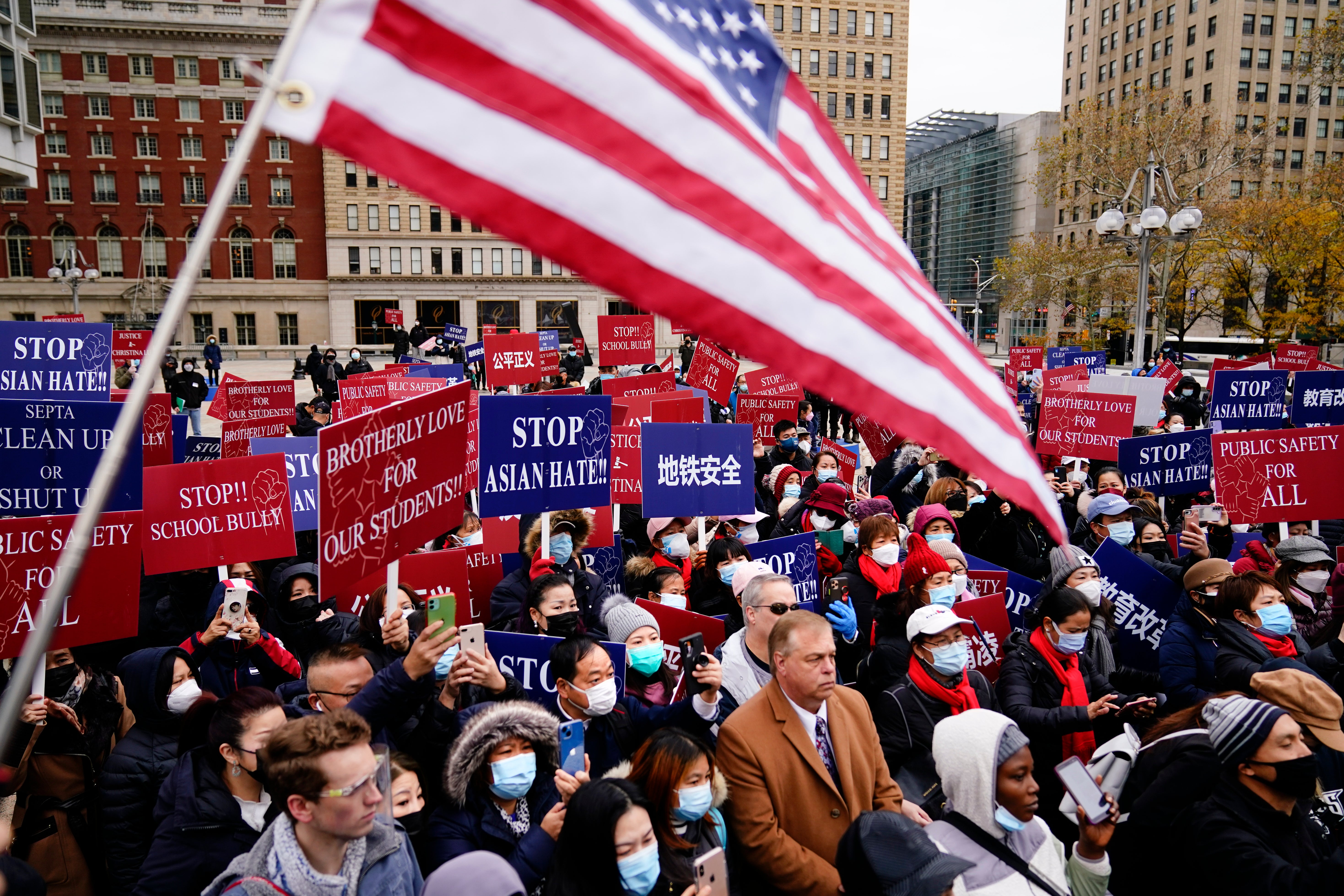 eople gather for a Stop Asian Hate rally in the wake of what police said was a racial attack on Asian American students on the subway, in Philadelphia, Tuesday, Nov. 30, 2021