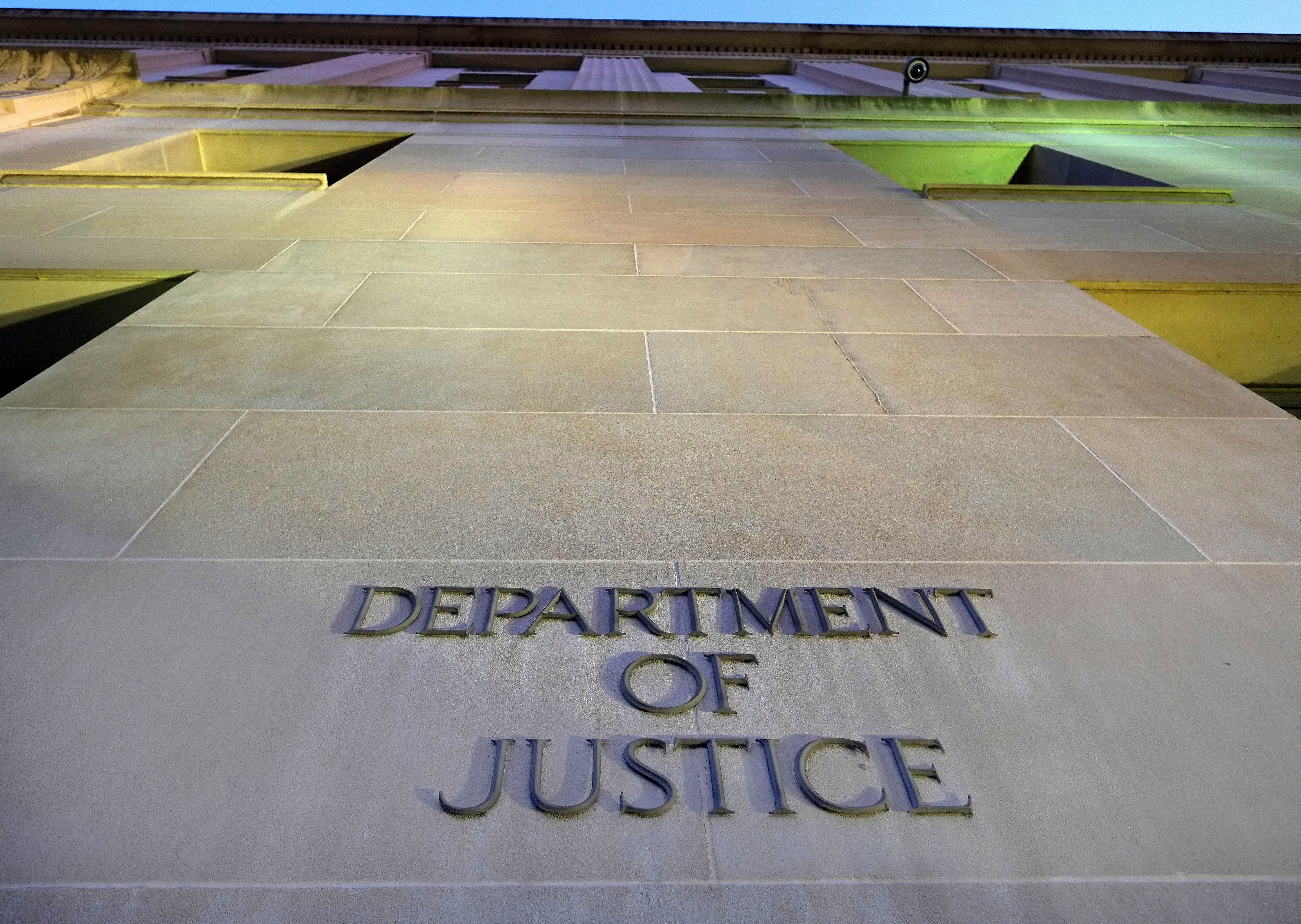 The Department of Justice has suspended one of its top attorneys