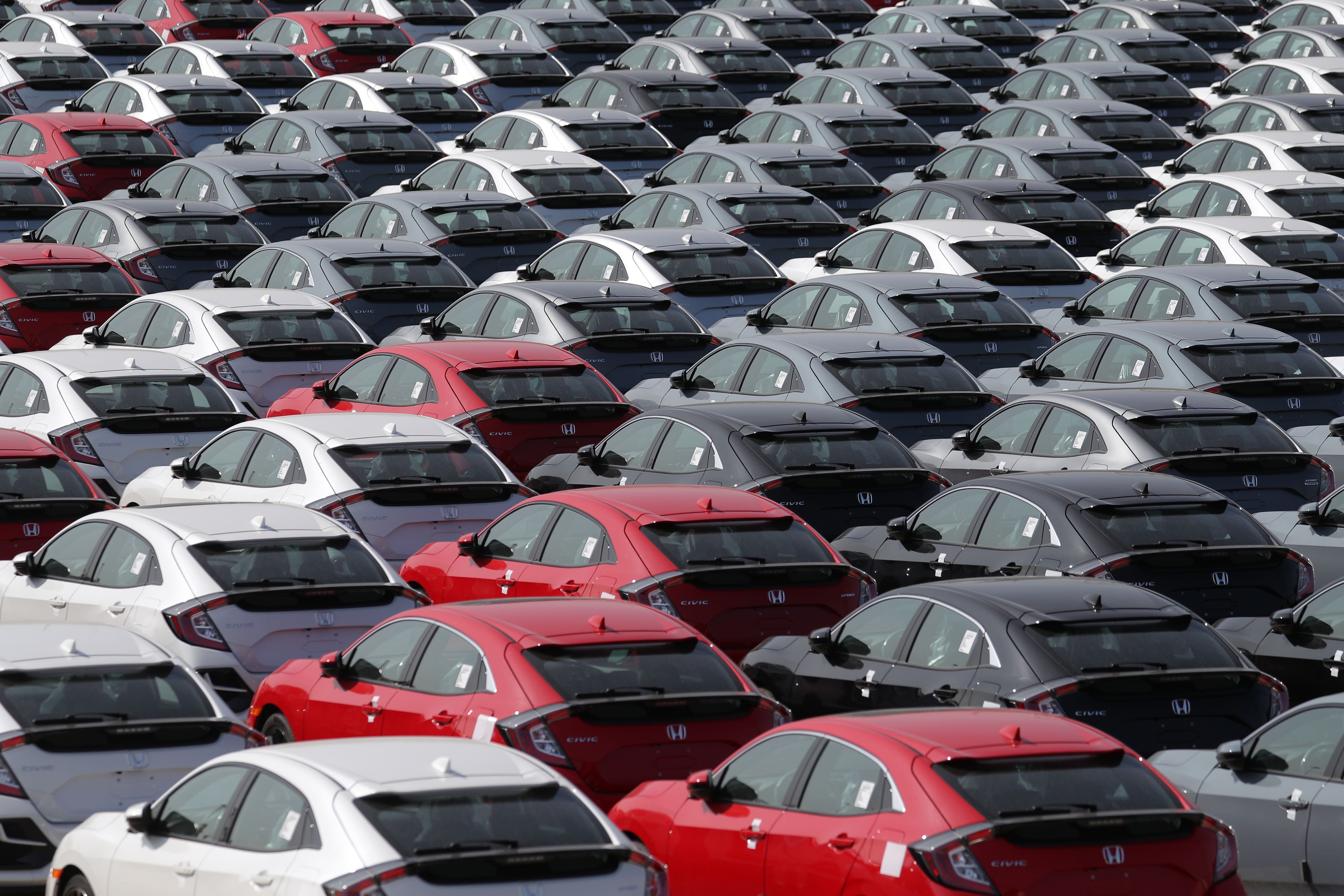 The FTSE 100 was lower as European markets were impacted by US car tariff plans (PA)