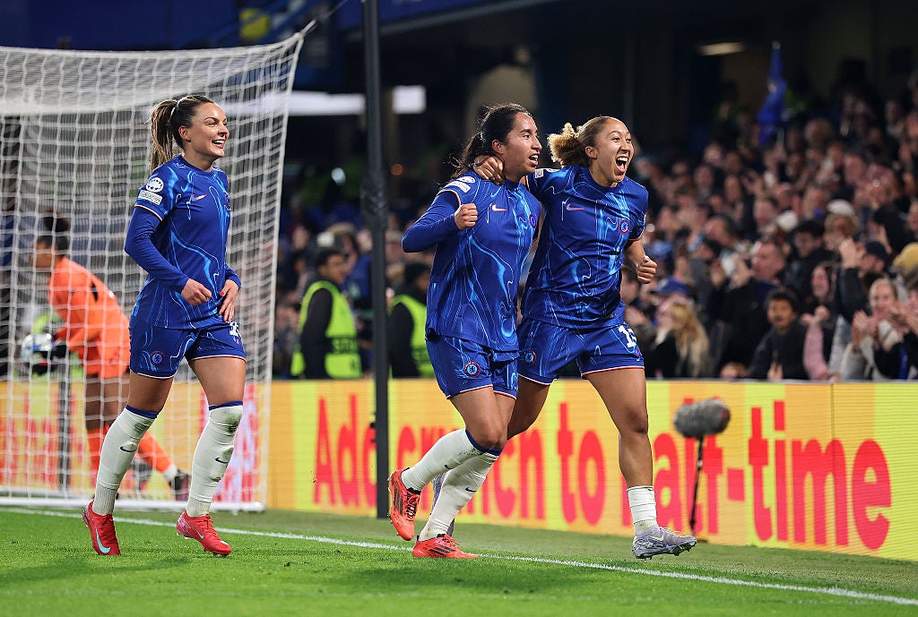 Mayra Ramirez, centre, and Lauren James, right, celebrate Chelsea’s third of the night
