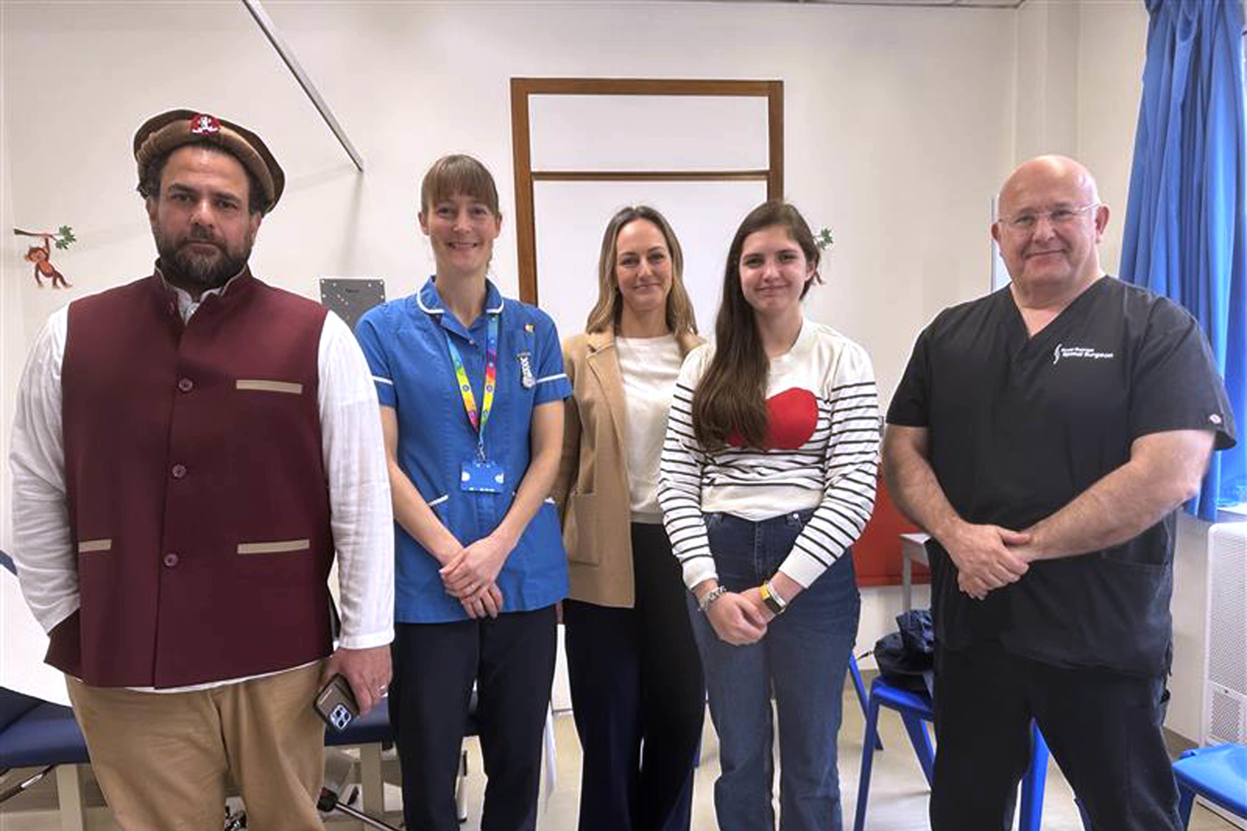 Aliza Rae AliKhan (second right) with (left to right) her father Faiysal AliKhan, spinal cord injury nurse specialist Jo Newman, mother Thirza AliKhan and consultant spinal surgeon Evan Davies